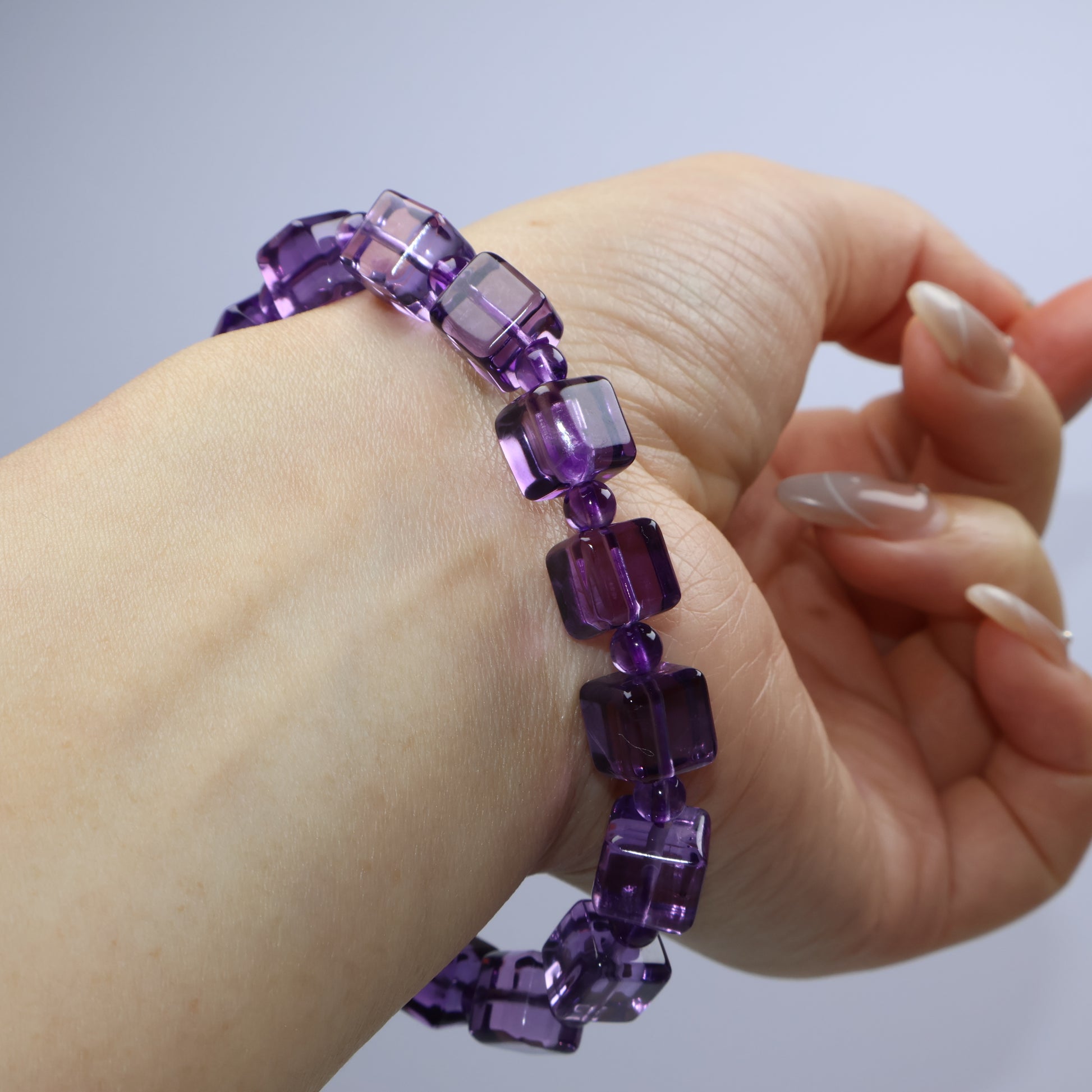 Natural wrist curve pose to highlight stacking or solo wearing