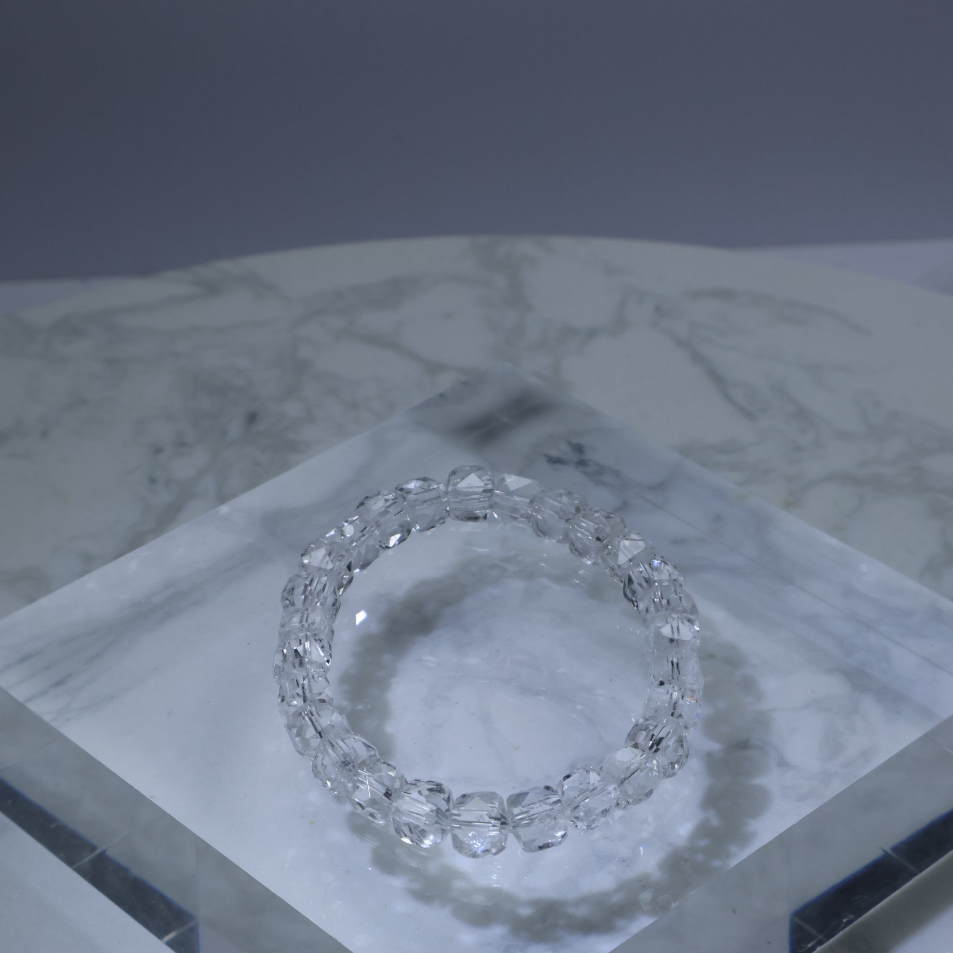Faceted clear quartz bracelet on acrylic display – 6mm sparkling crystal beads