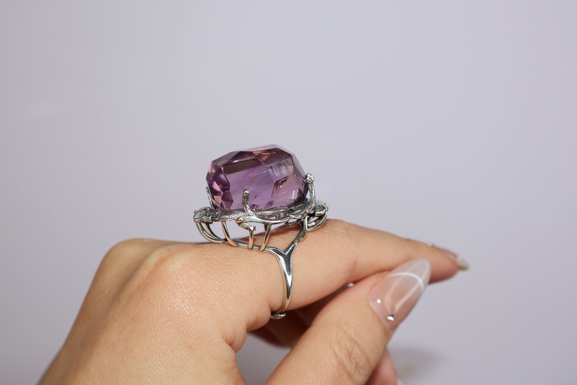 Freeform Ametrine ring with twin fish and floral S925 silver setting, shown on hand with adjustable band and nature-inspired design