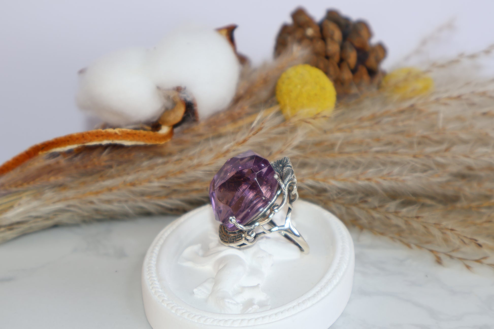 Back angle showing natural faceted Ametrine in symbolic silver setting