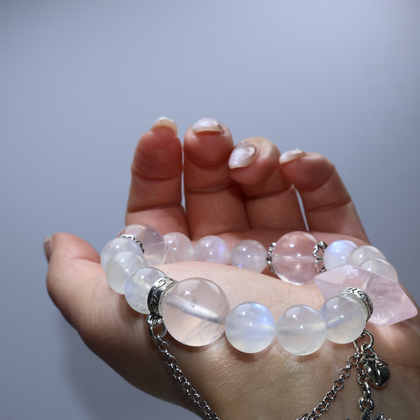 Artistic side angle highlighting soft pink tones and moonstone glow