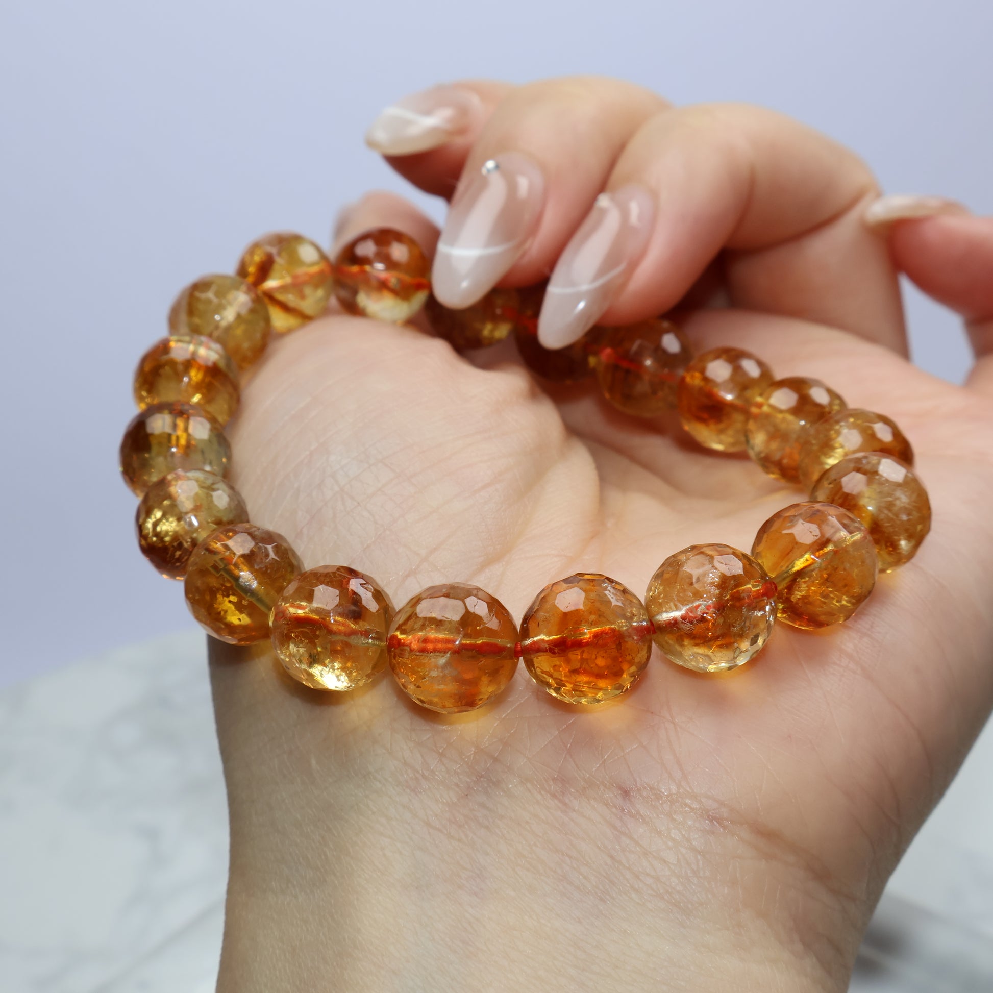 Angled wrist shot focusing on citrine’s internal clarity and subtle color variations