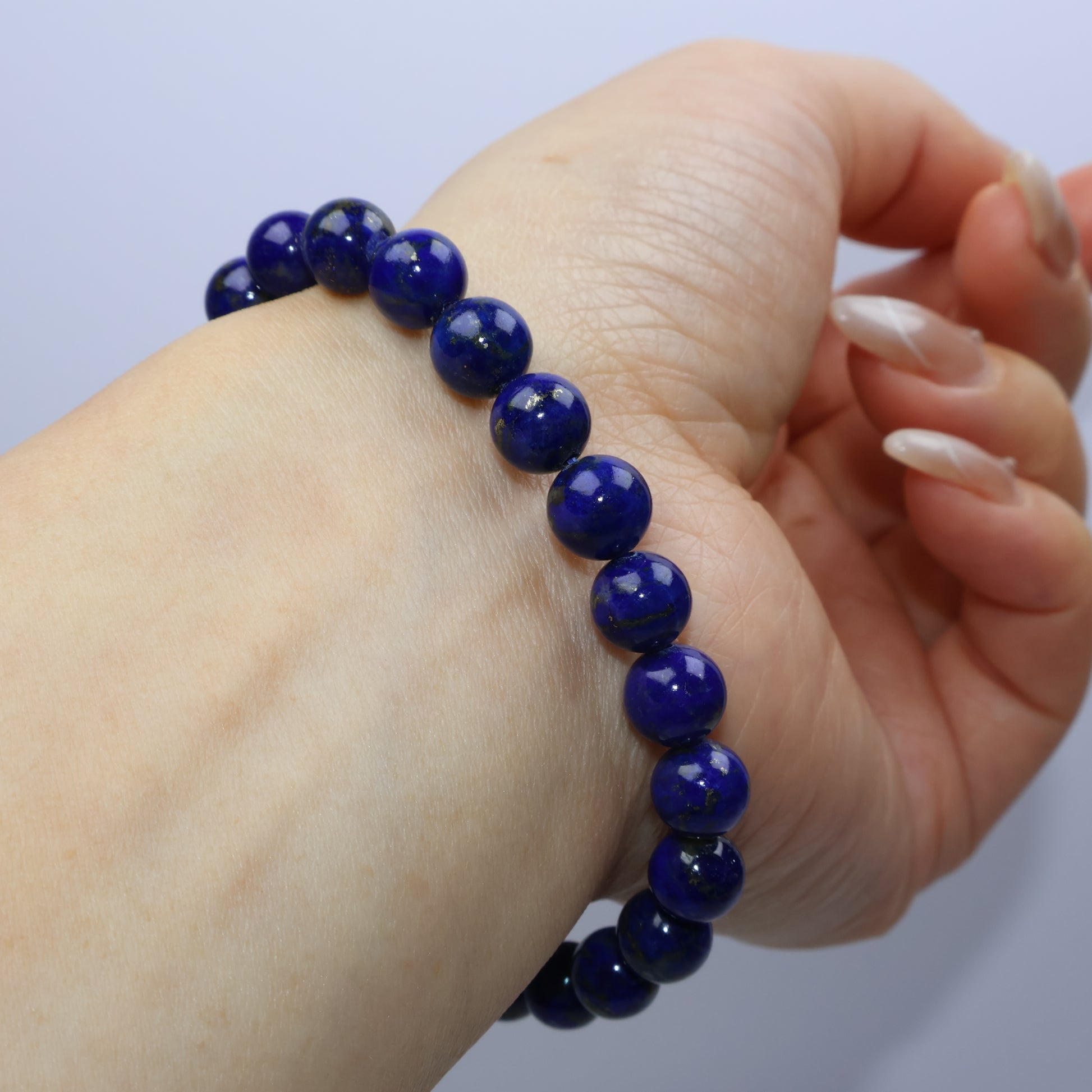 Wrist side view emphasizing bead color uniformity and clean polish