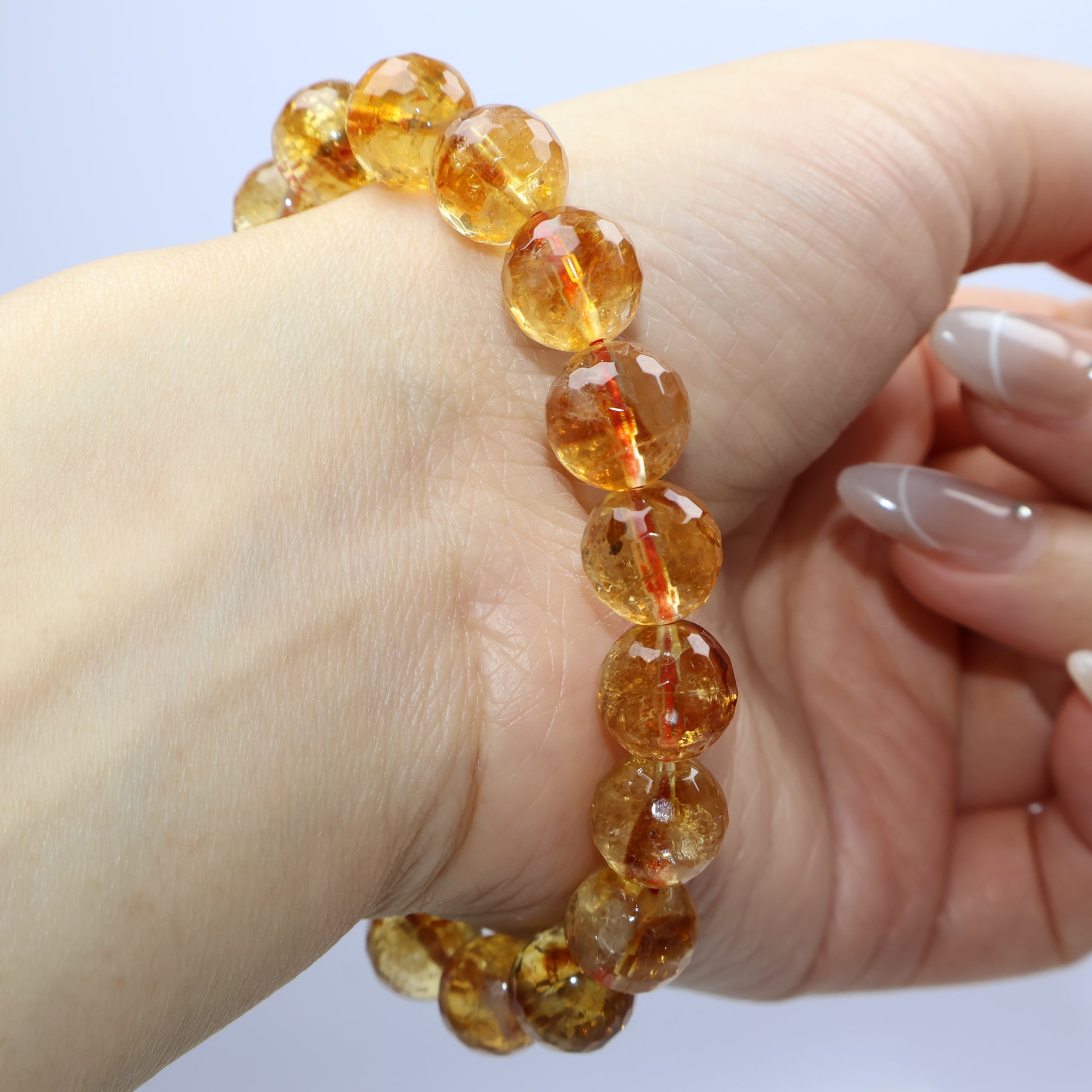 Wrist-angle view capturing the golden hue and natural inclusions in each bead