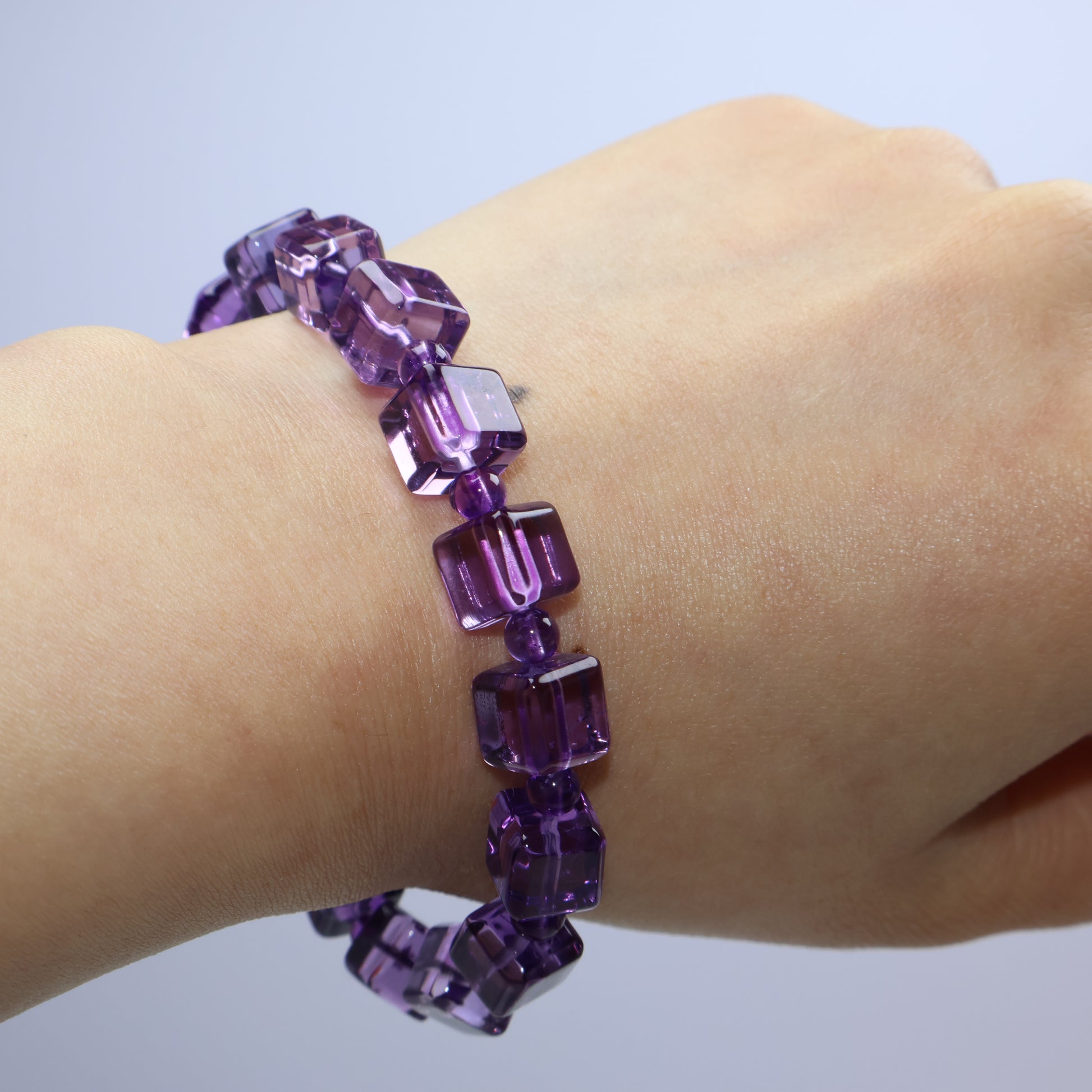 Wrist shot showing elegant fit and radiant purple color