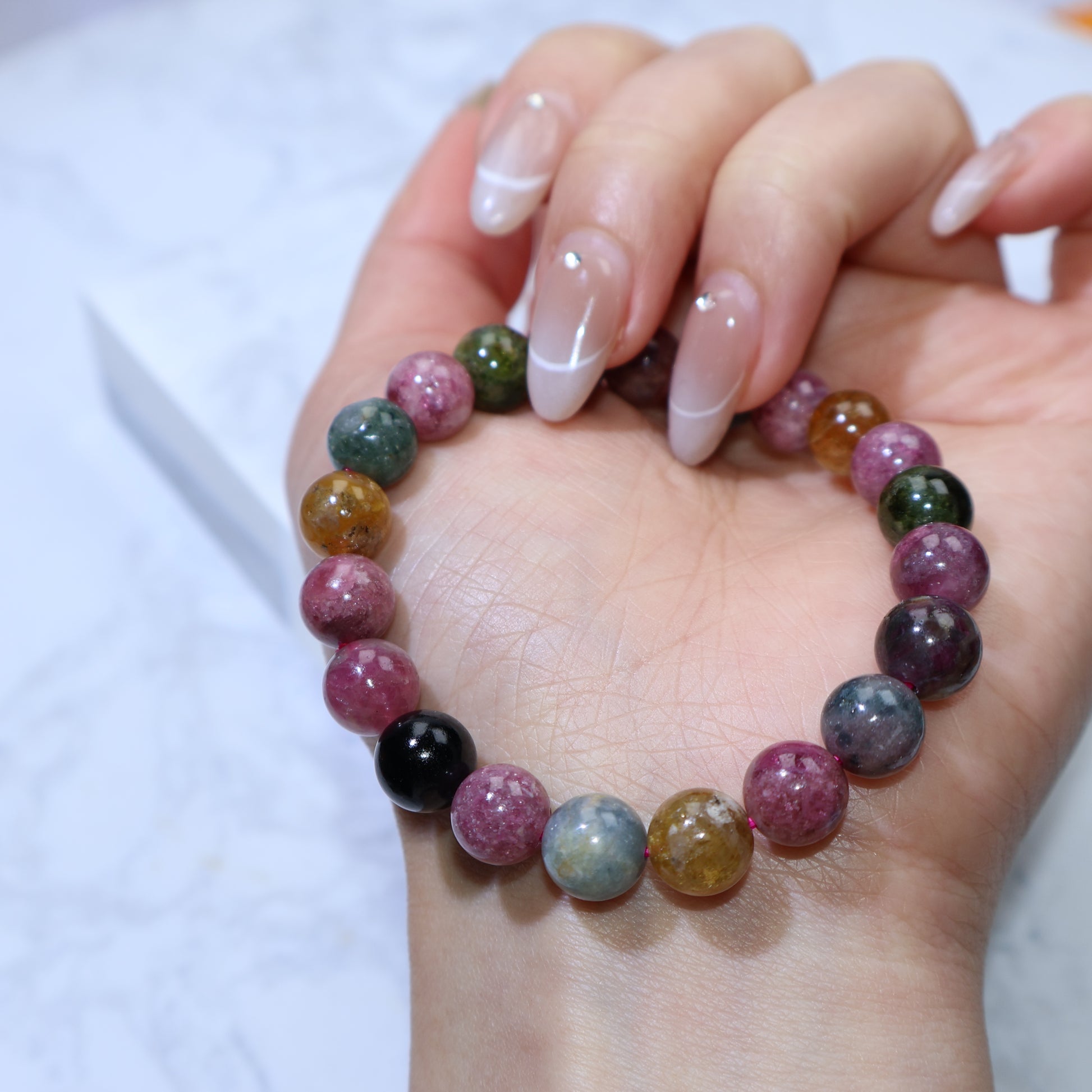 Close-up of tourmaline beads highlighting natural patterns and vibrant colors