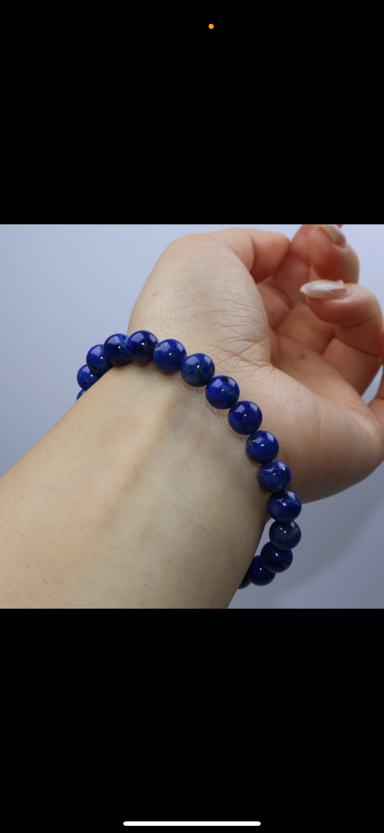 Wrist shot of 7mm Lapis Lazuli bracelet worn on a 15cm wrist, showing deep blue tone and subtle pyrite sparkles