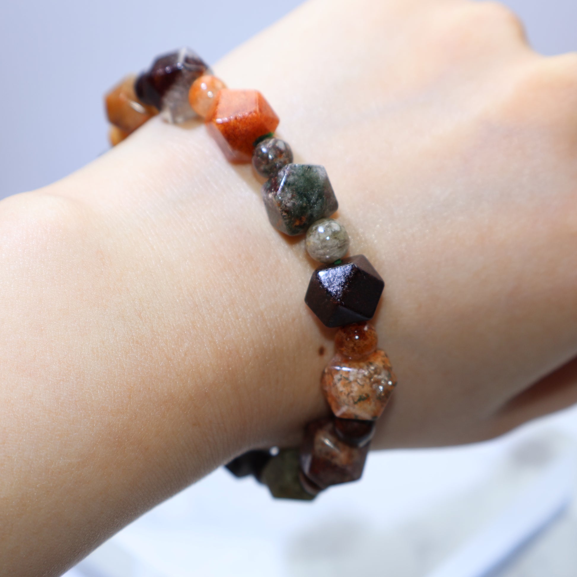 Wrist shot wearing 11mm Multi-Phantom Quartz bracelet, showing fit for 16cm wrist