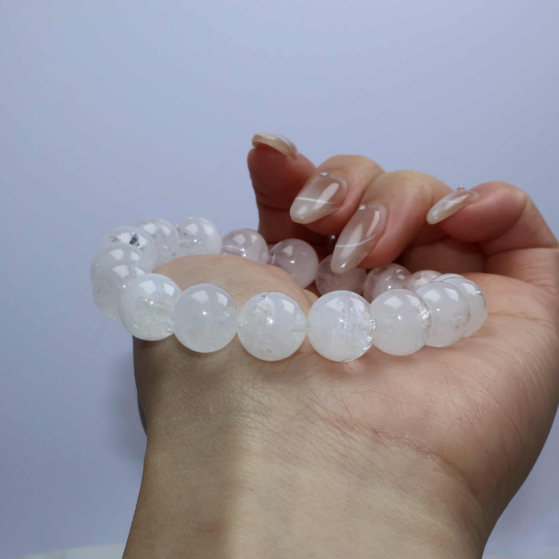 Macro close-up of beads showing phantom-like inclusions and rainbow flashes