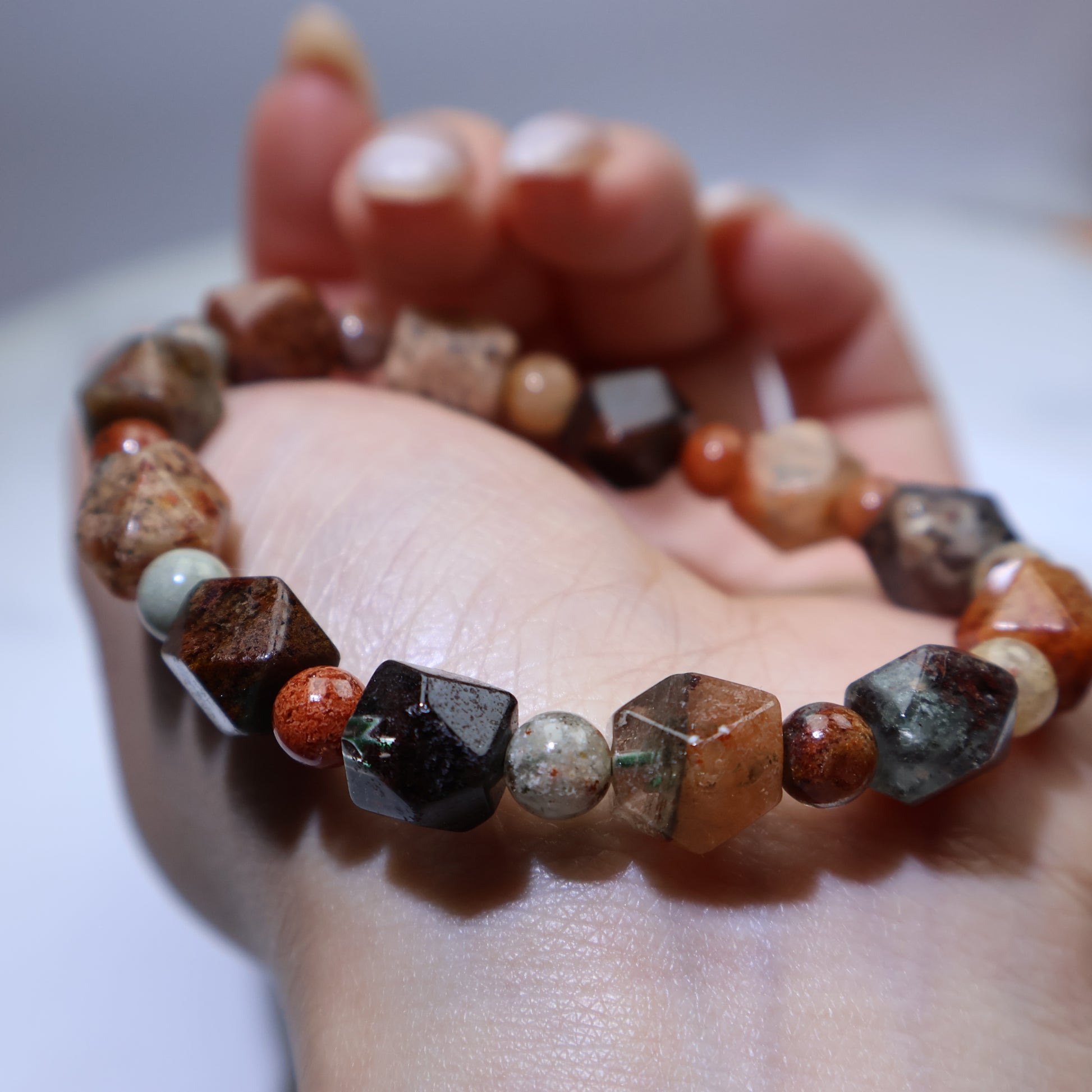 Palm view highlighting full mineral inclusions and mixed bead rhythm