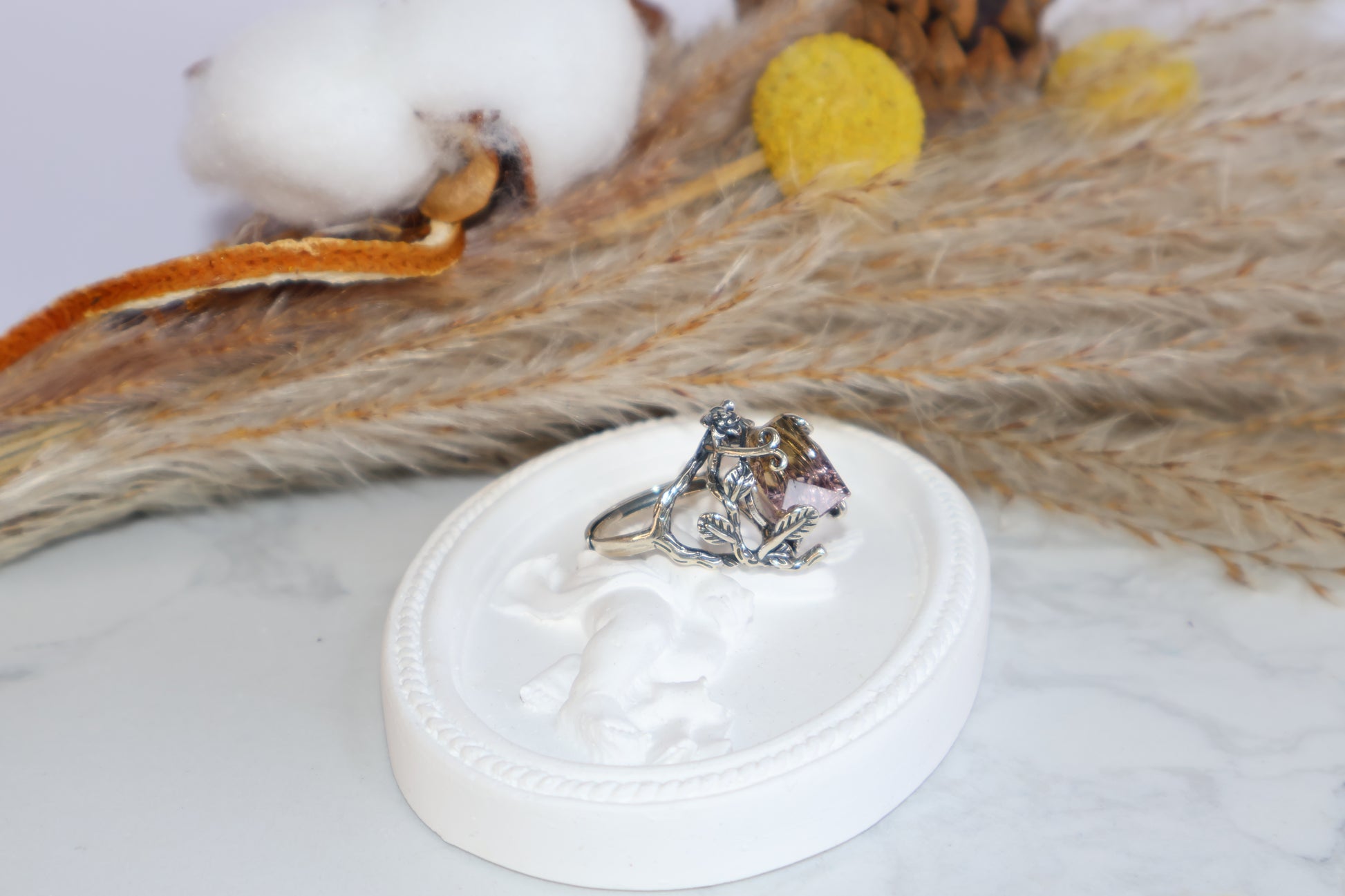 Adjustable S925 Ametrine ring held in hand with clear side vine details