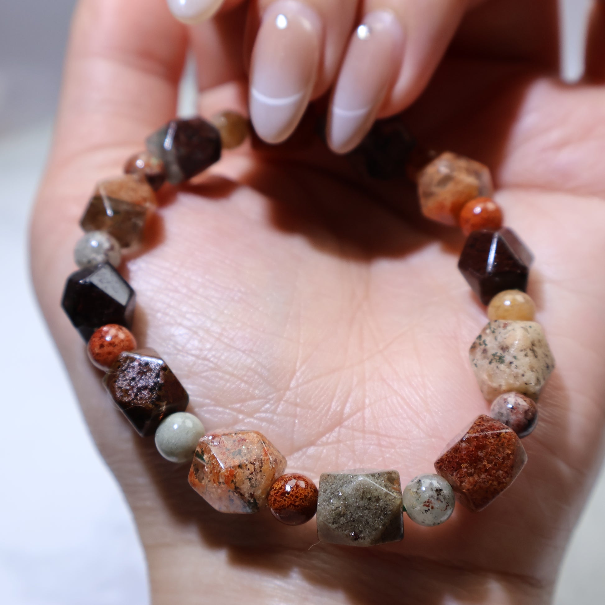 Handheld side angle with varied textures across the bracelet