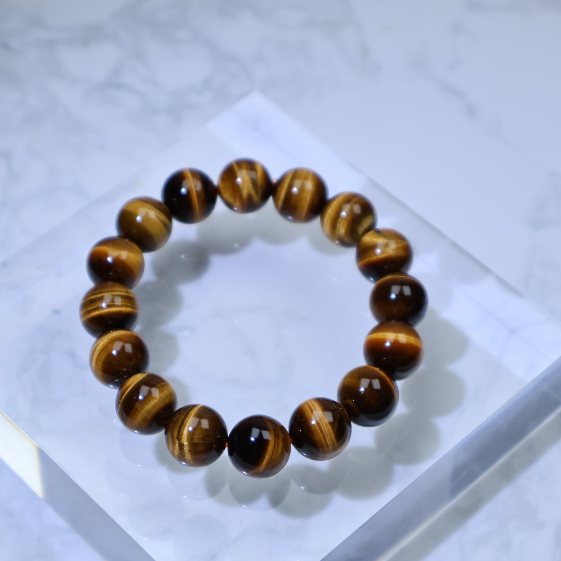 Angled top-down view highlighting the bracelet’s rich stripes and polished finish