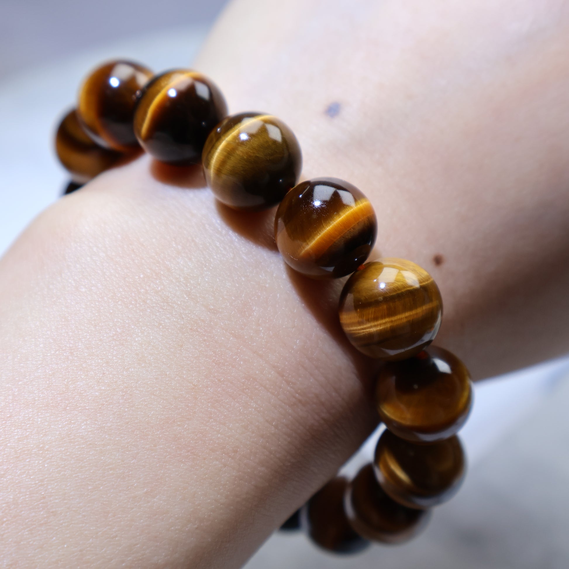 Wrist close-up showing bracelet fit and polished surface