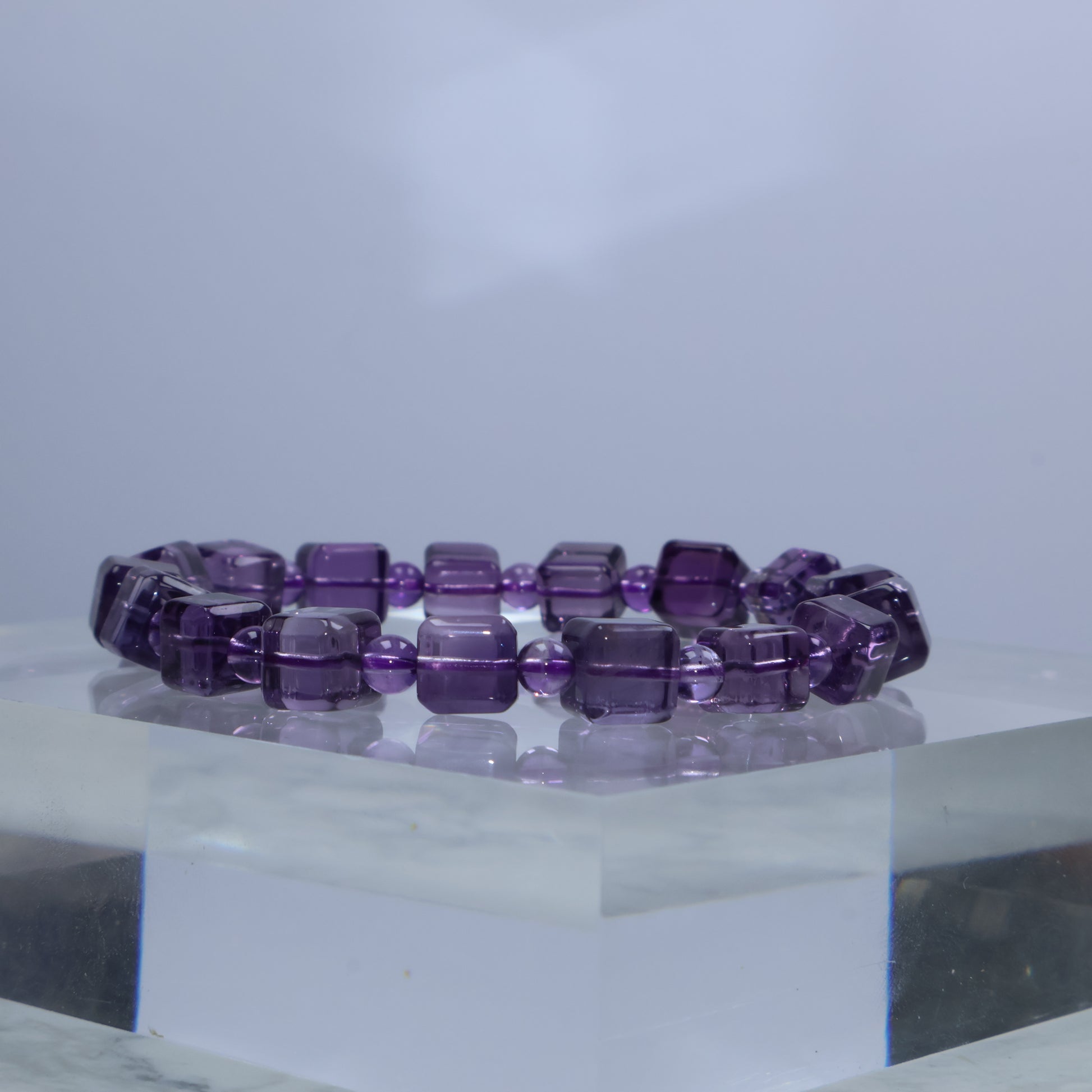 Side angle showcasing clarity and faceting of square Amethyst beads