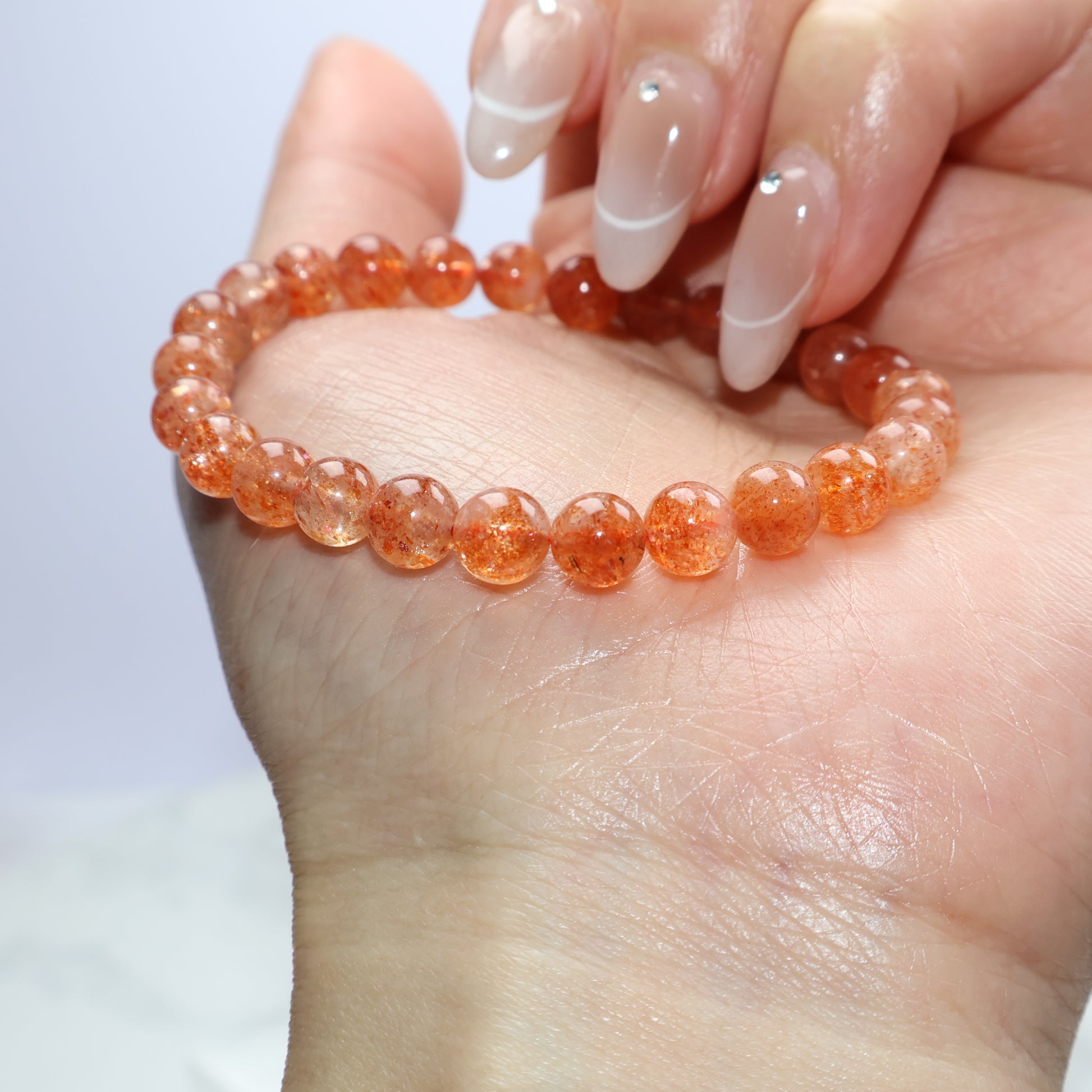 Side view of Sunstone bracelet highlighting shimmer and round beads