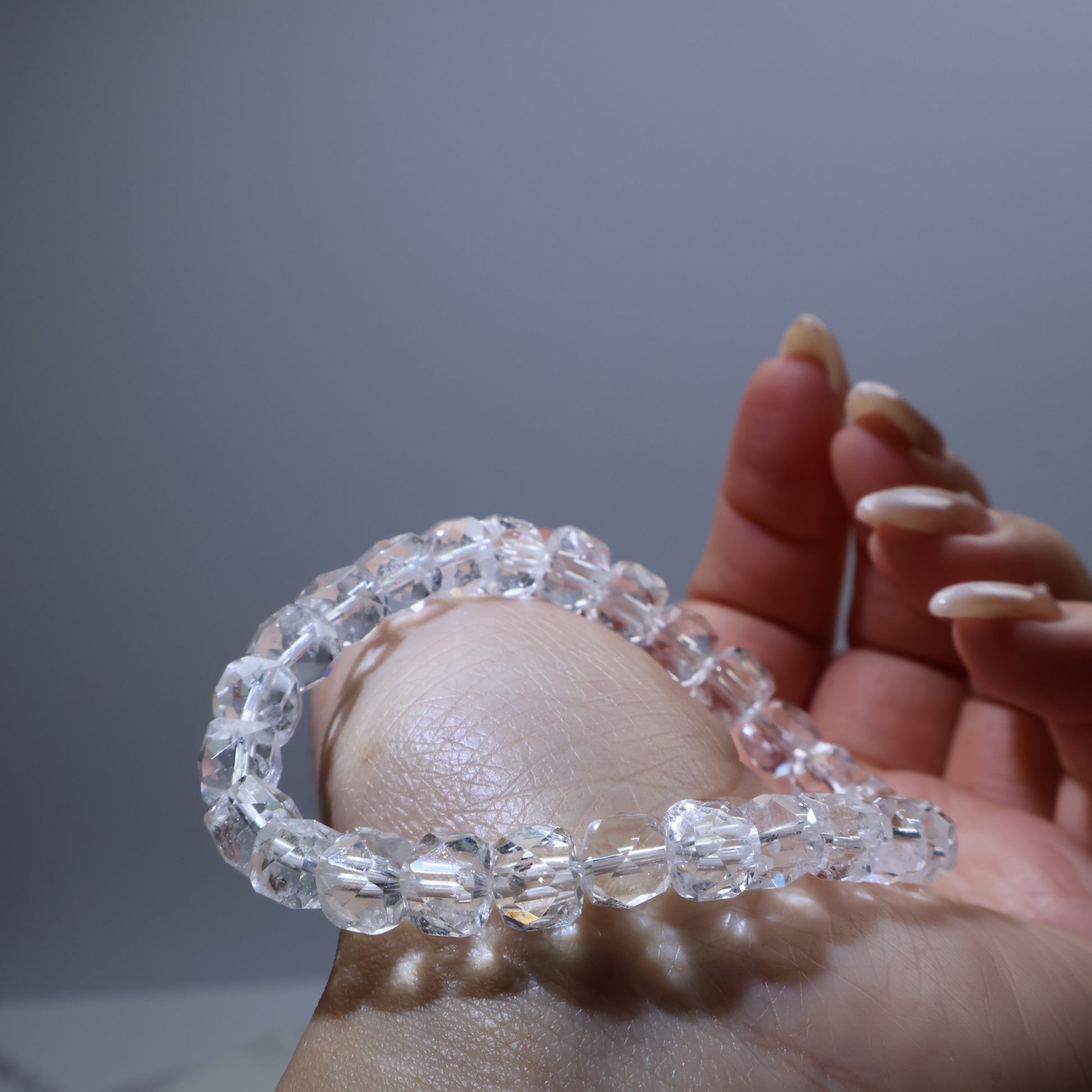 Side view showing cut facets reflecting light – 6mm crystal for daily wear