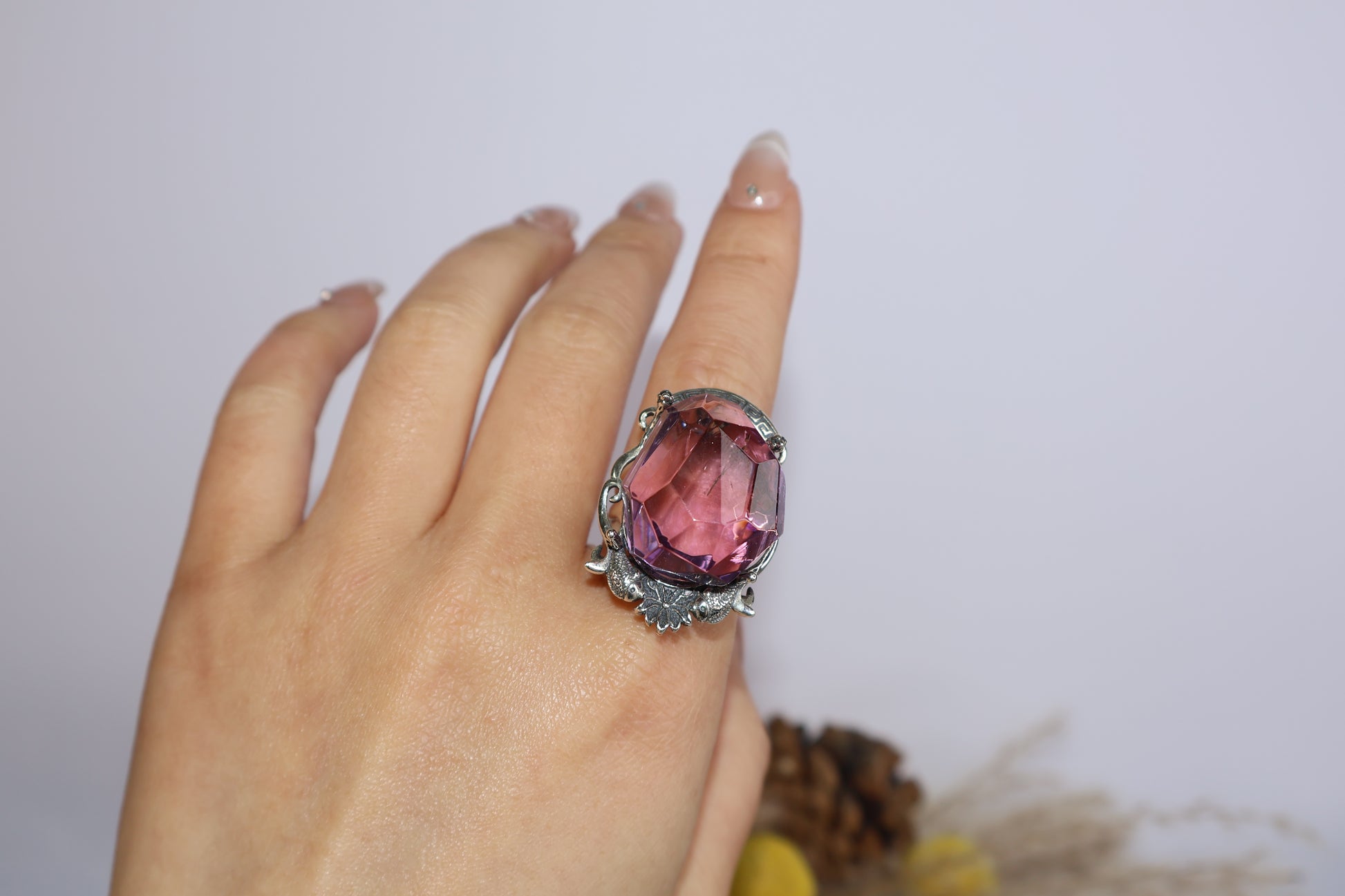 Full hand shot showing statement Ametrine ring with nature-inspired silverwork