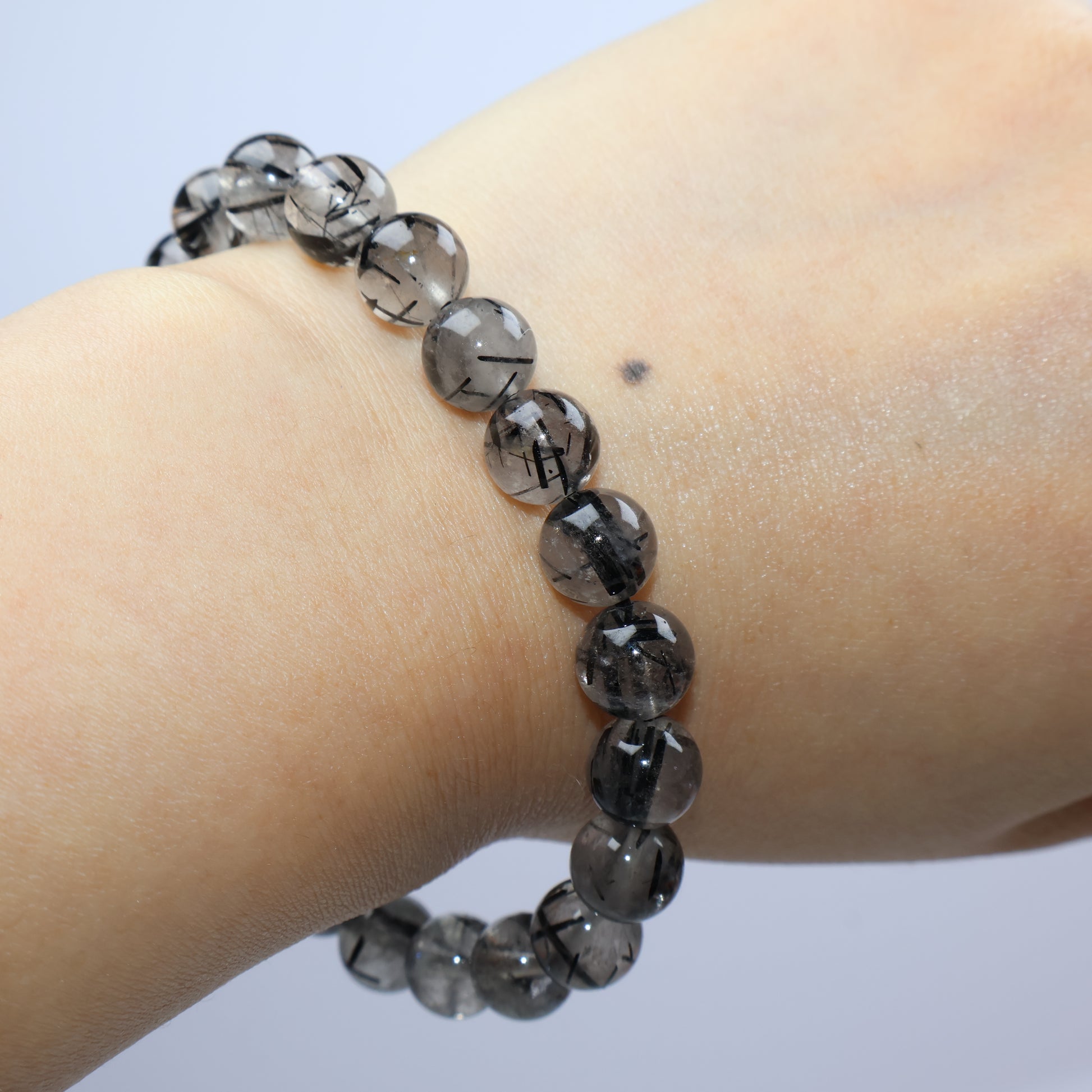Horizontal wrist shot showing the entire bracelet against light skin tone