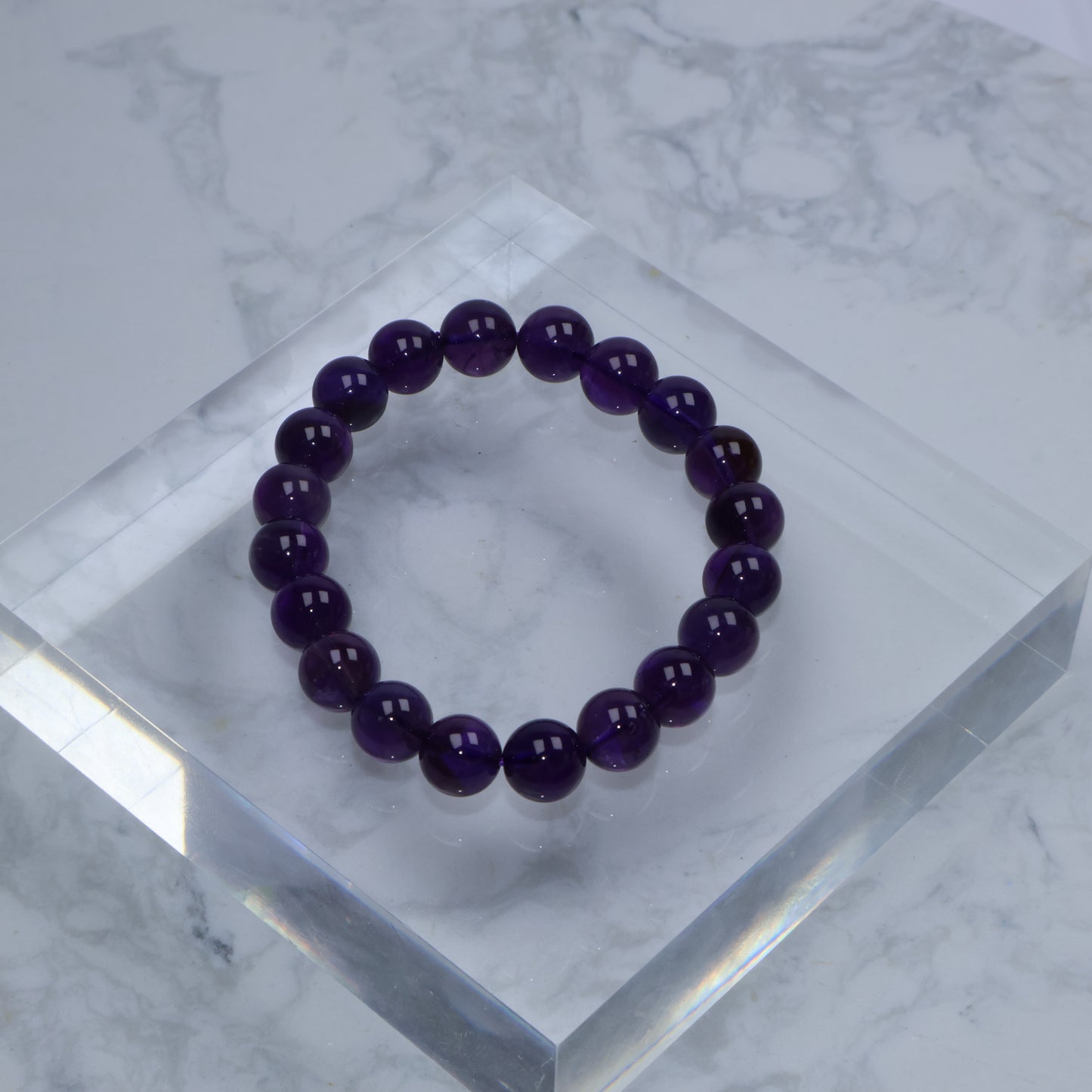 Top-down view of Amethyst bracelet showcasing uniform dark purple tone