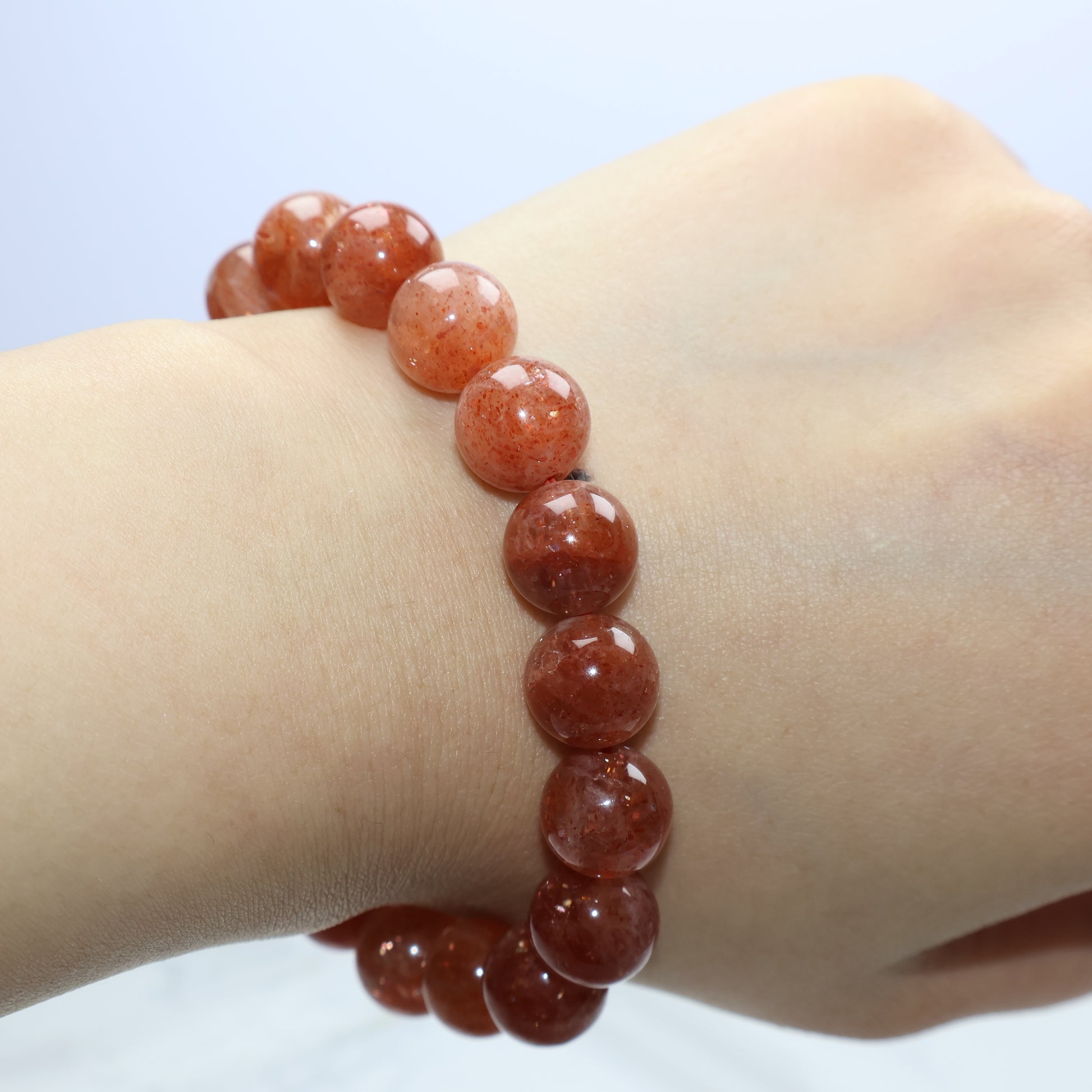 Side view of bracelet on wrist, highlighting fullness and shine