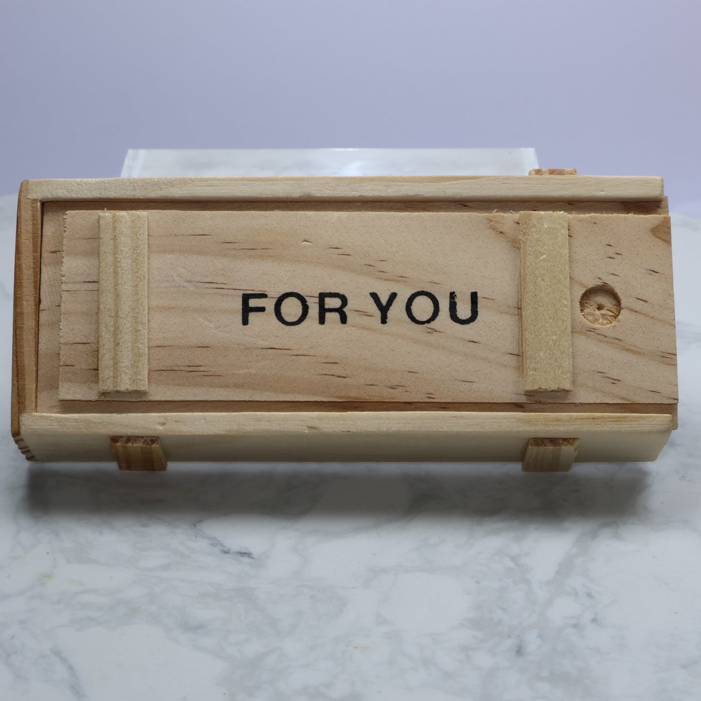 Closed wooden gift box with ‘FOR YOU’ text visible on top