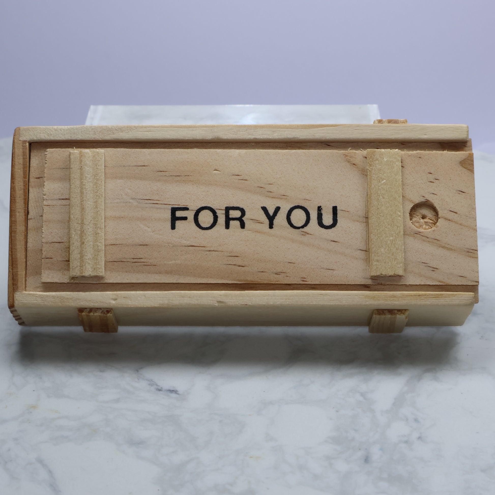 Closed wooden gift box with ‘FOR YOU’ text visible on top