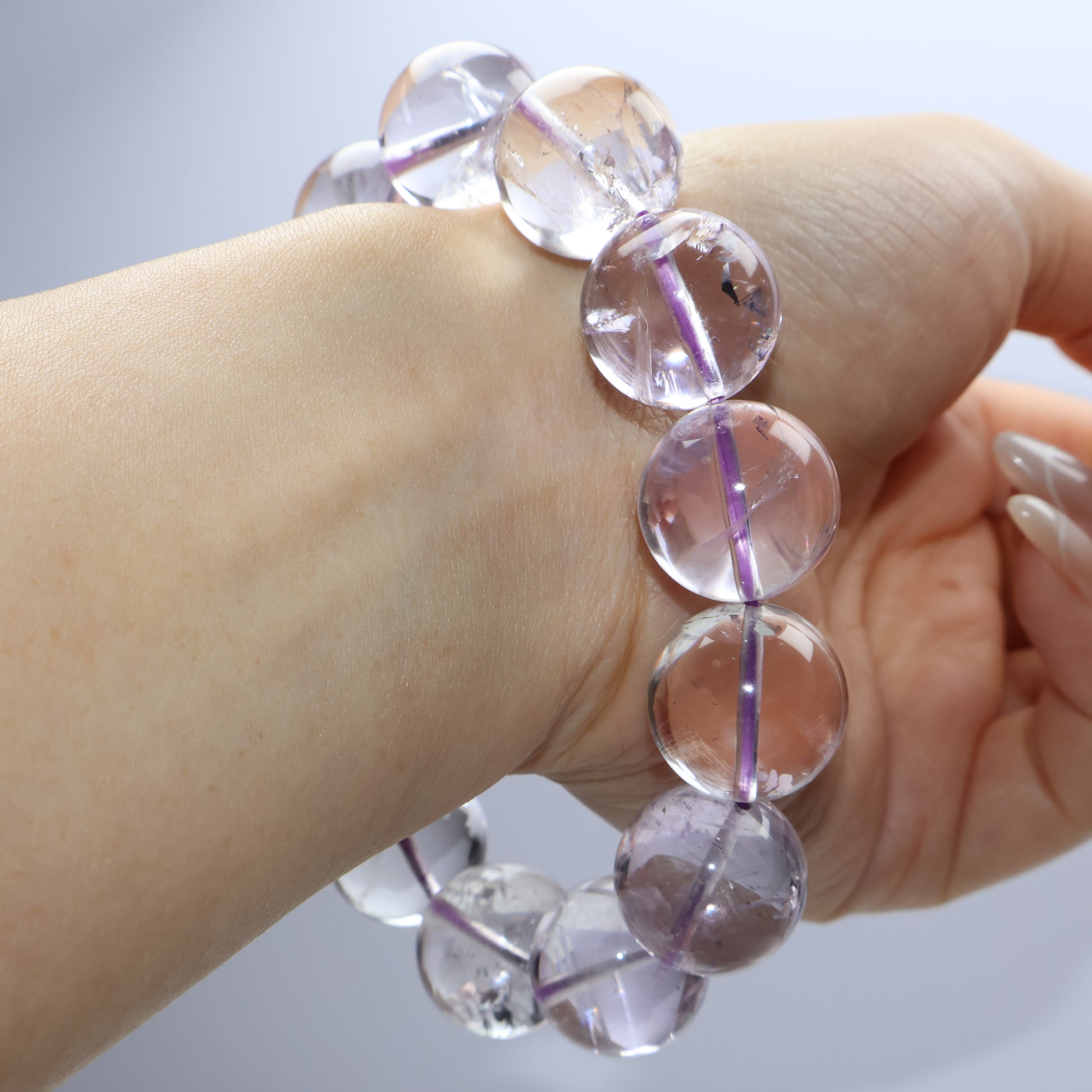 Worn on wrist – bold and elegant translucent purple crystal bracelet
