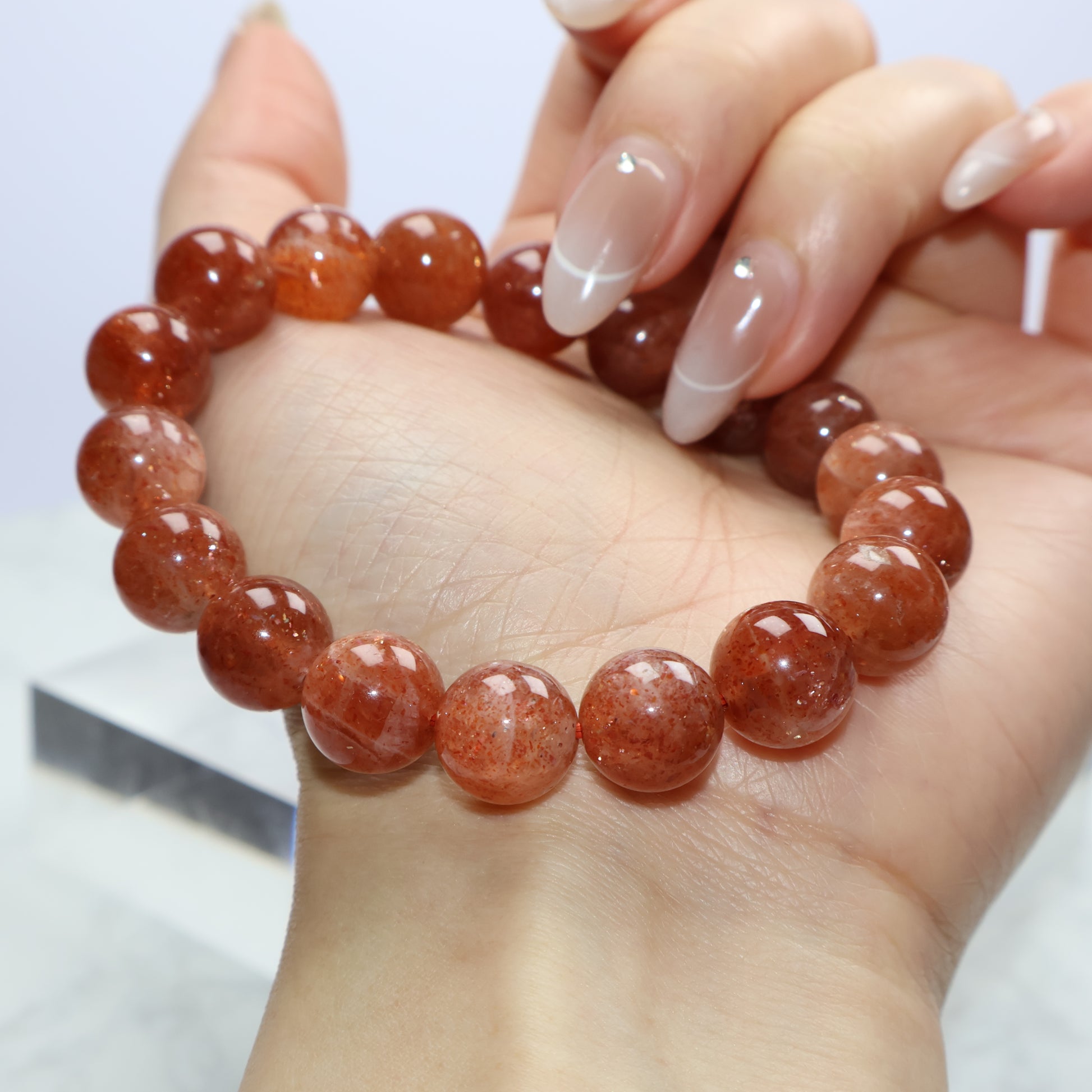 Side view of bracelet on wrist, highlighting fullness and shine