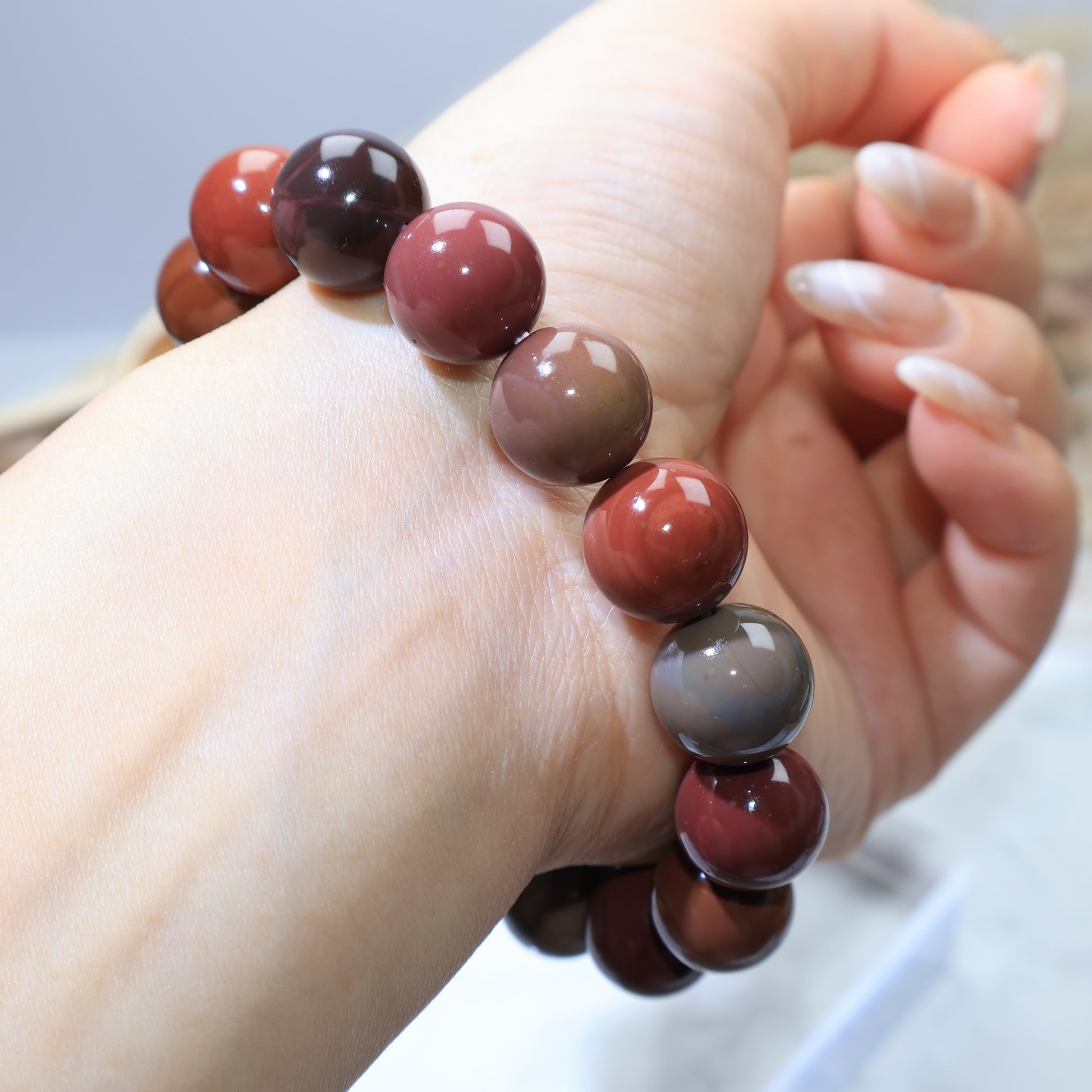 Reverse wrist view showing natural stone patterns and polished finish