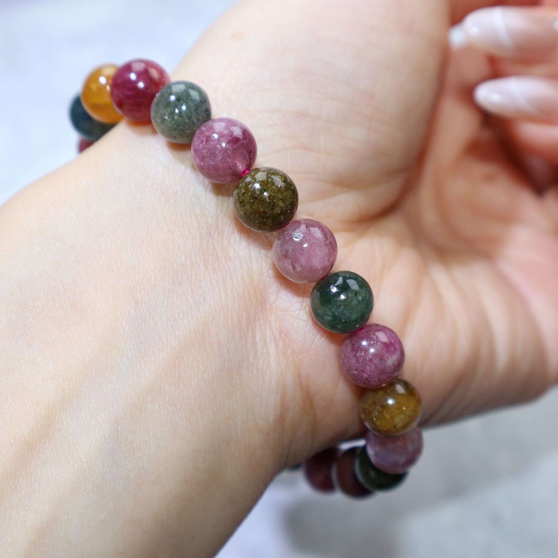 Angled wrist shot showing harmonious color combination and gemstone luster