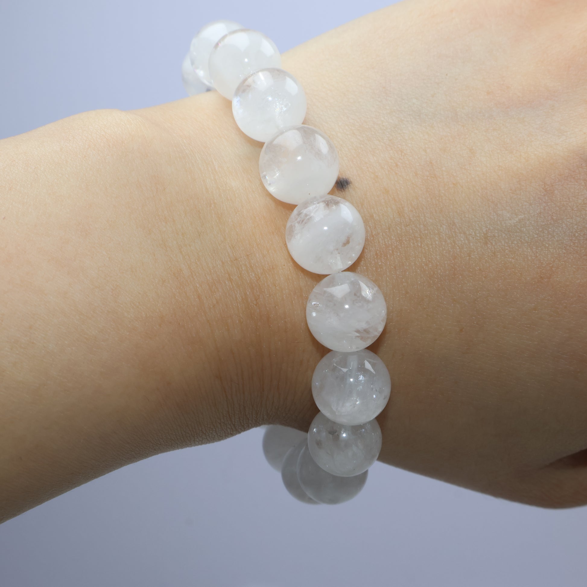 Wrist shot of White Phantom Quartz bracelet highlighting natural texture