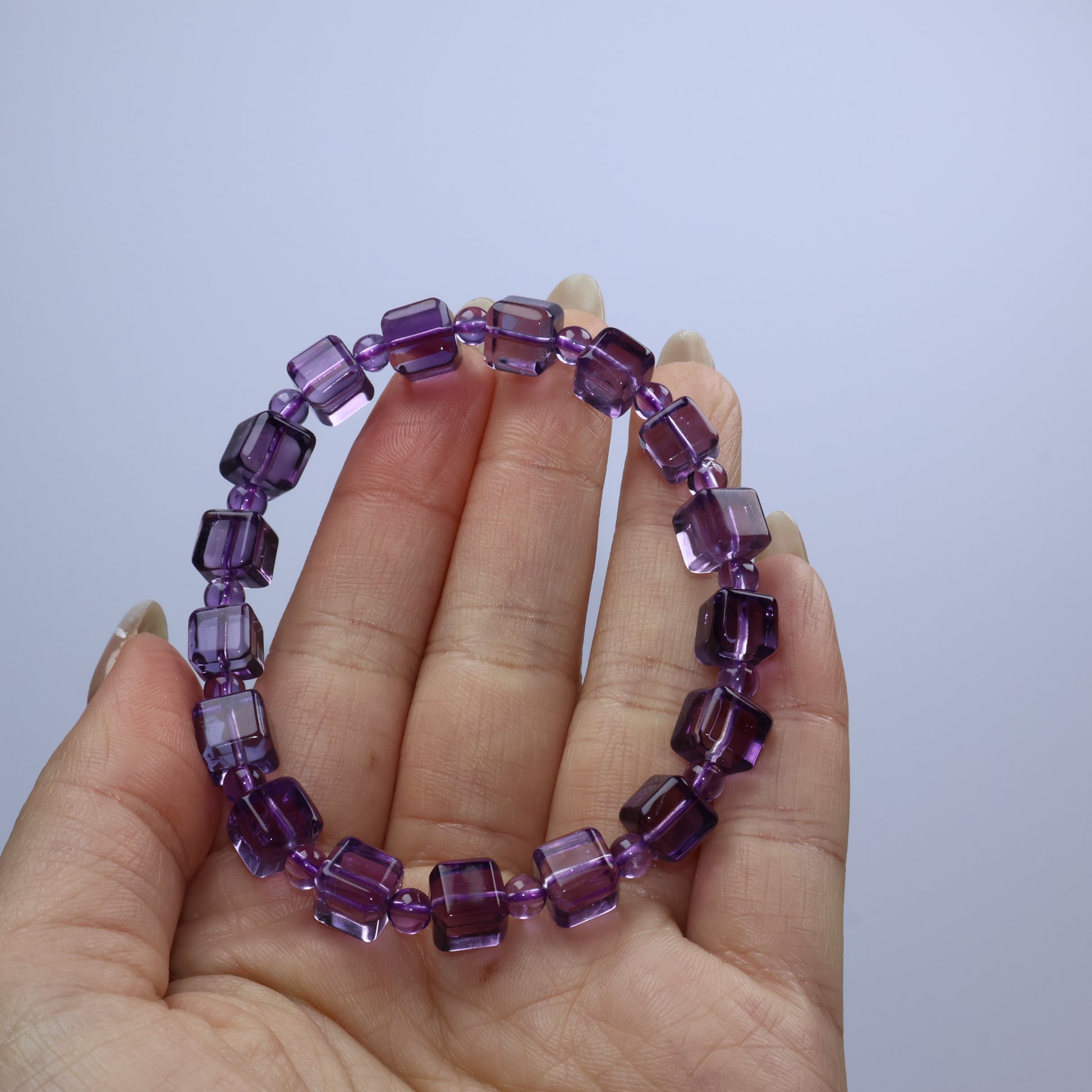 Handheld view showing vibrant purple tones and neat bead alignment