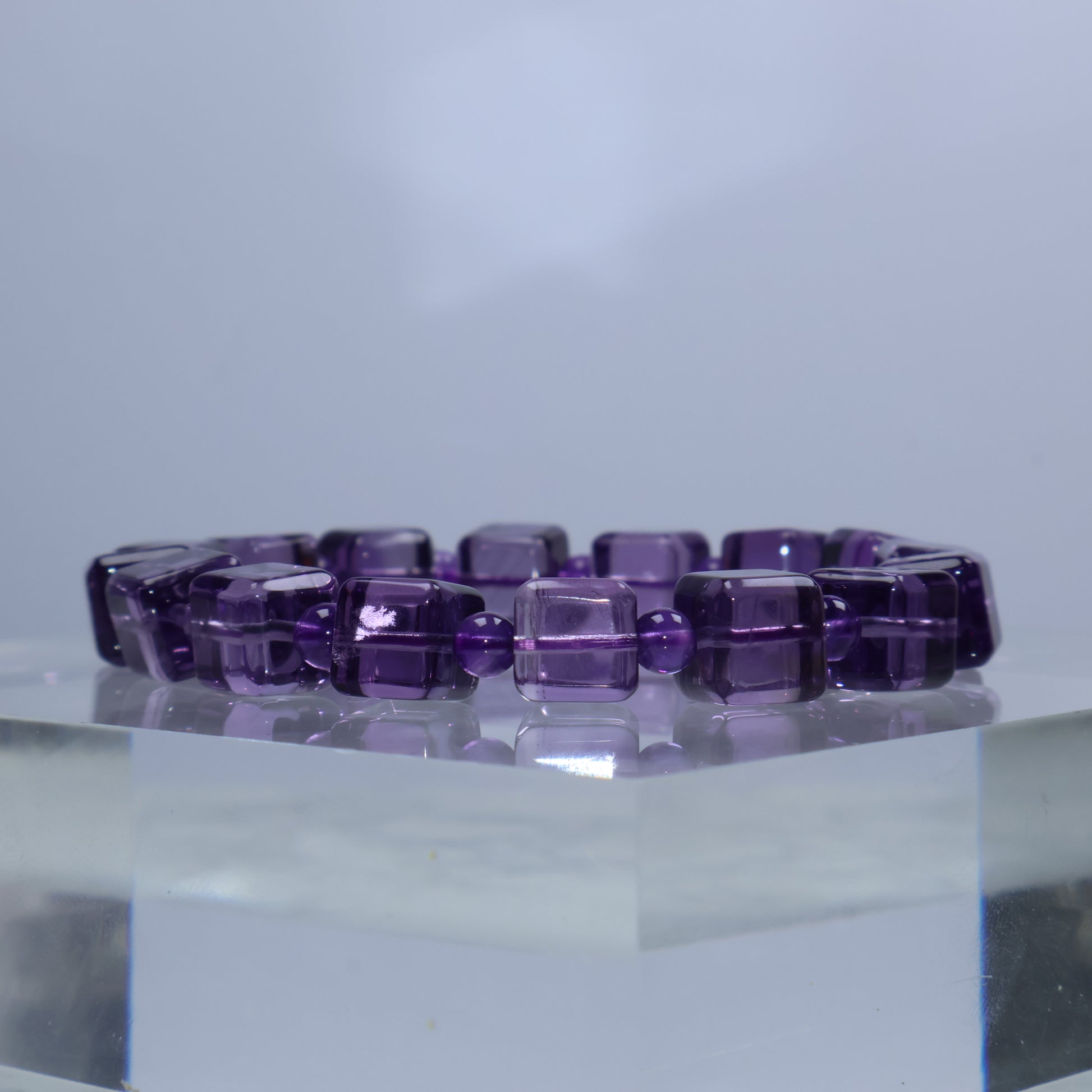 Side angle showcasing glossy square beads with light reflection