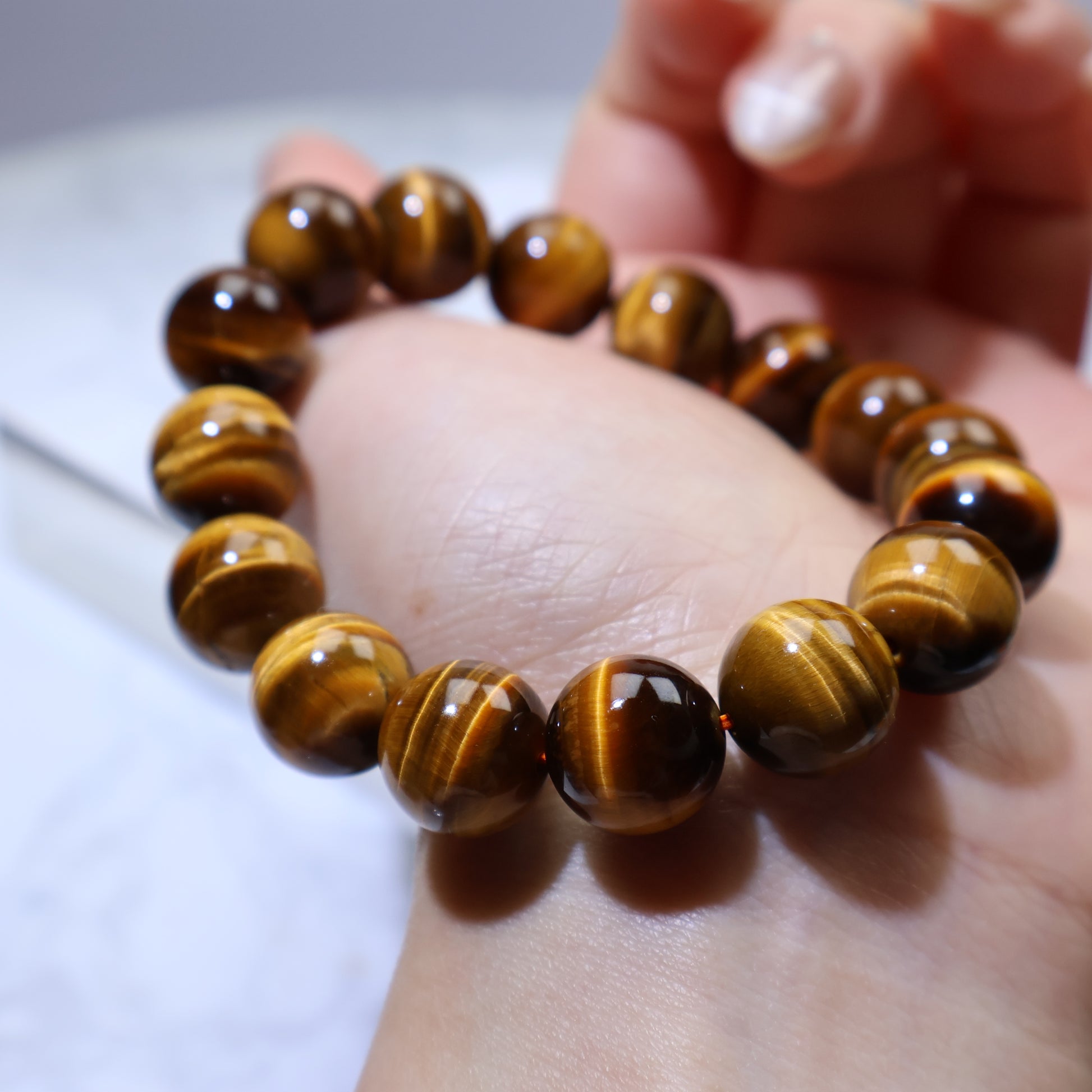 Close-up on palm showing silky chatoyance and natural banding