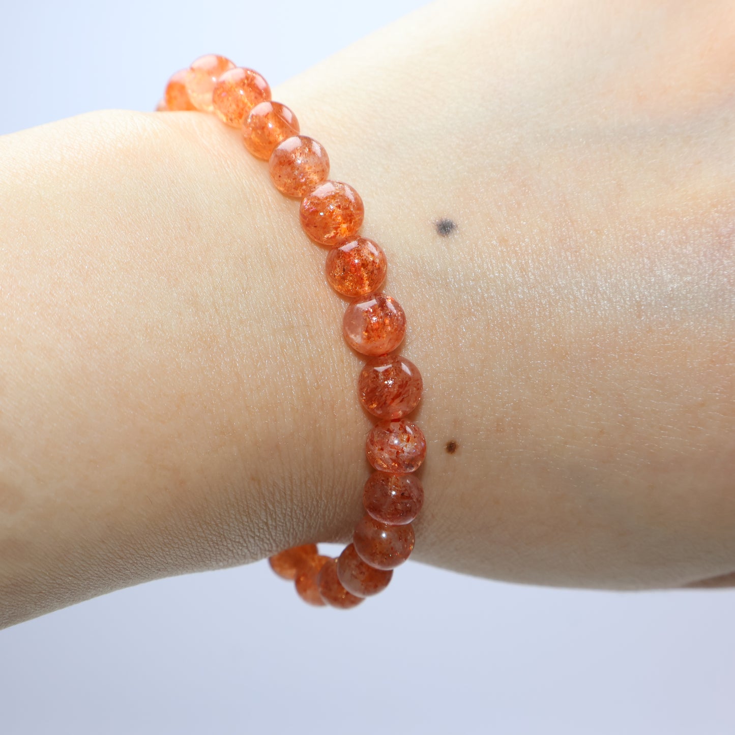 Wrist shot of Sunstone bracelet under soft light