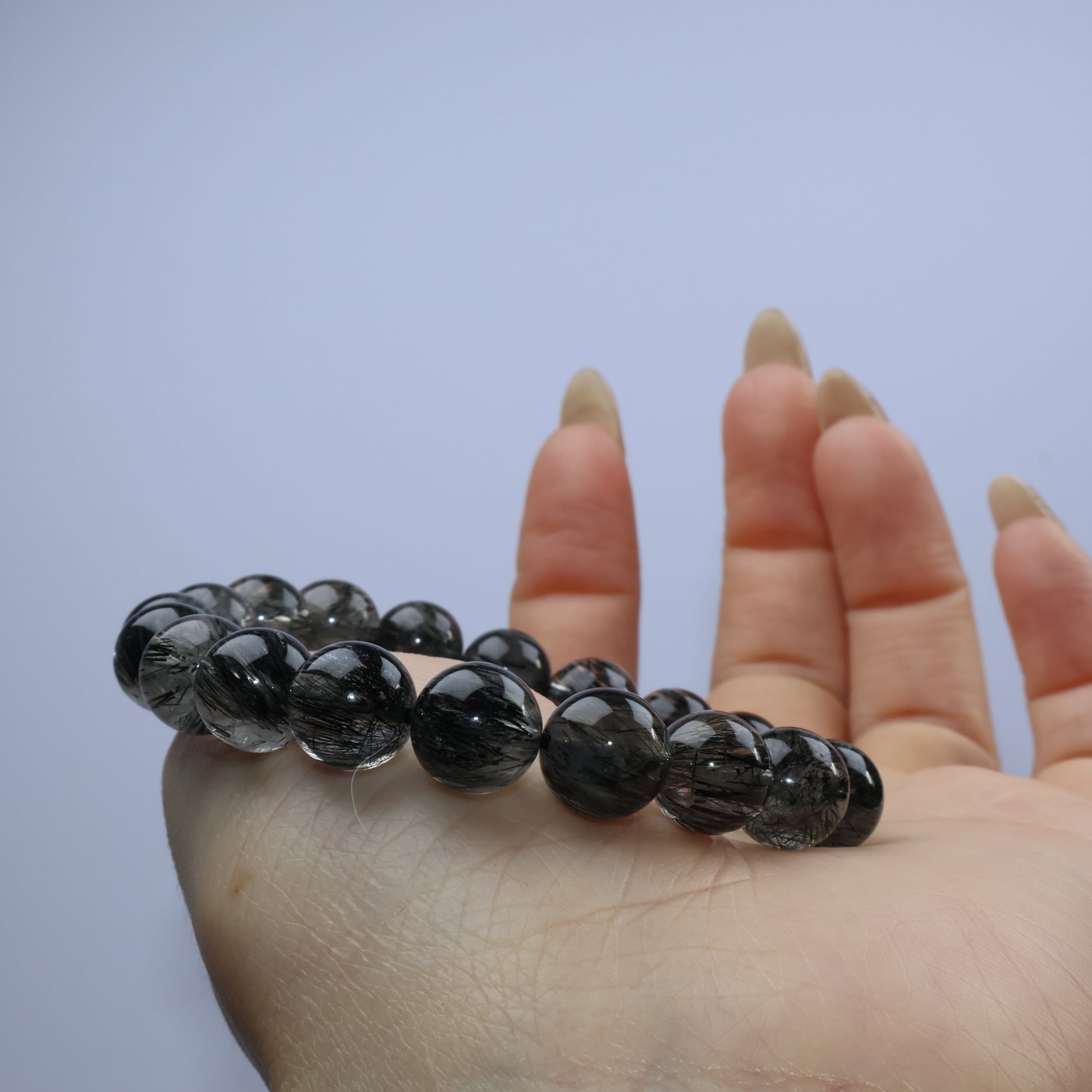 Palm shot showing bracelet curve and inner light reflections