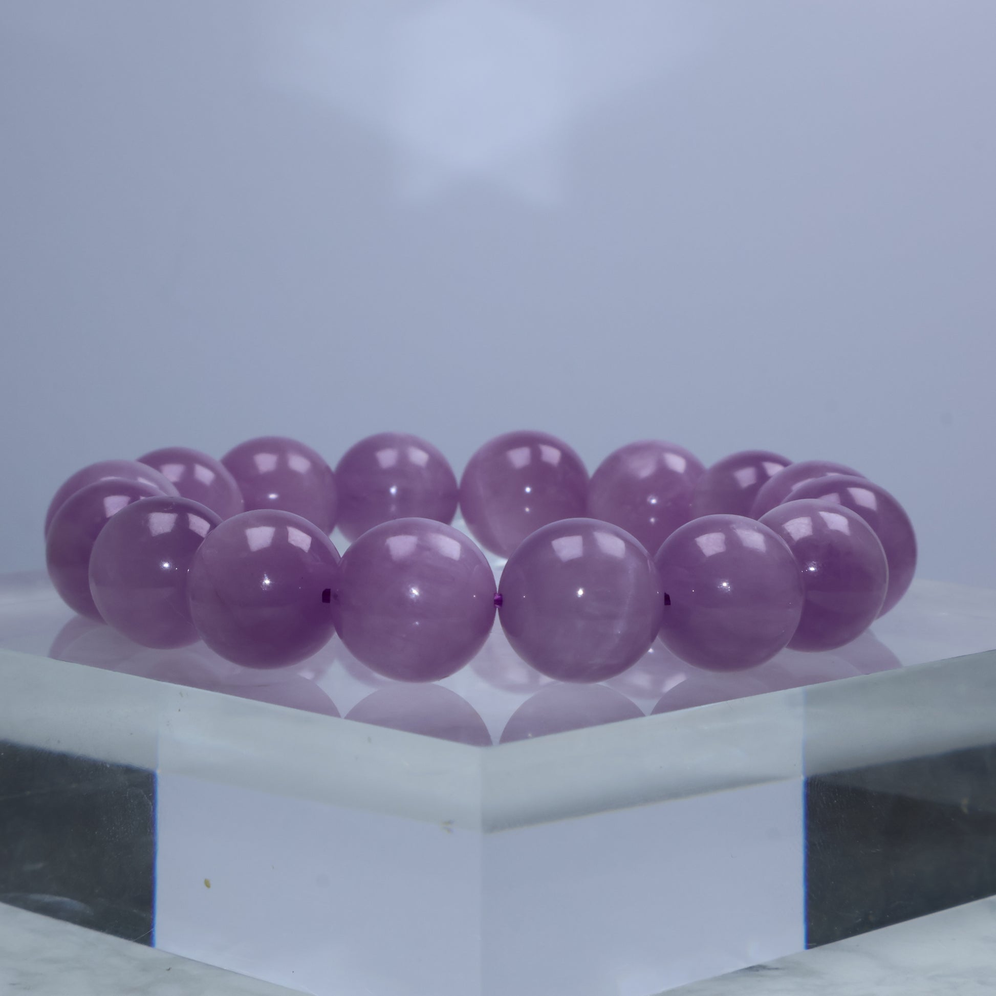 Side angle showing soft glow and semi-translucent tones of Lepidolite beads