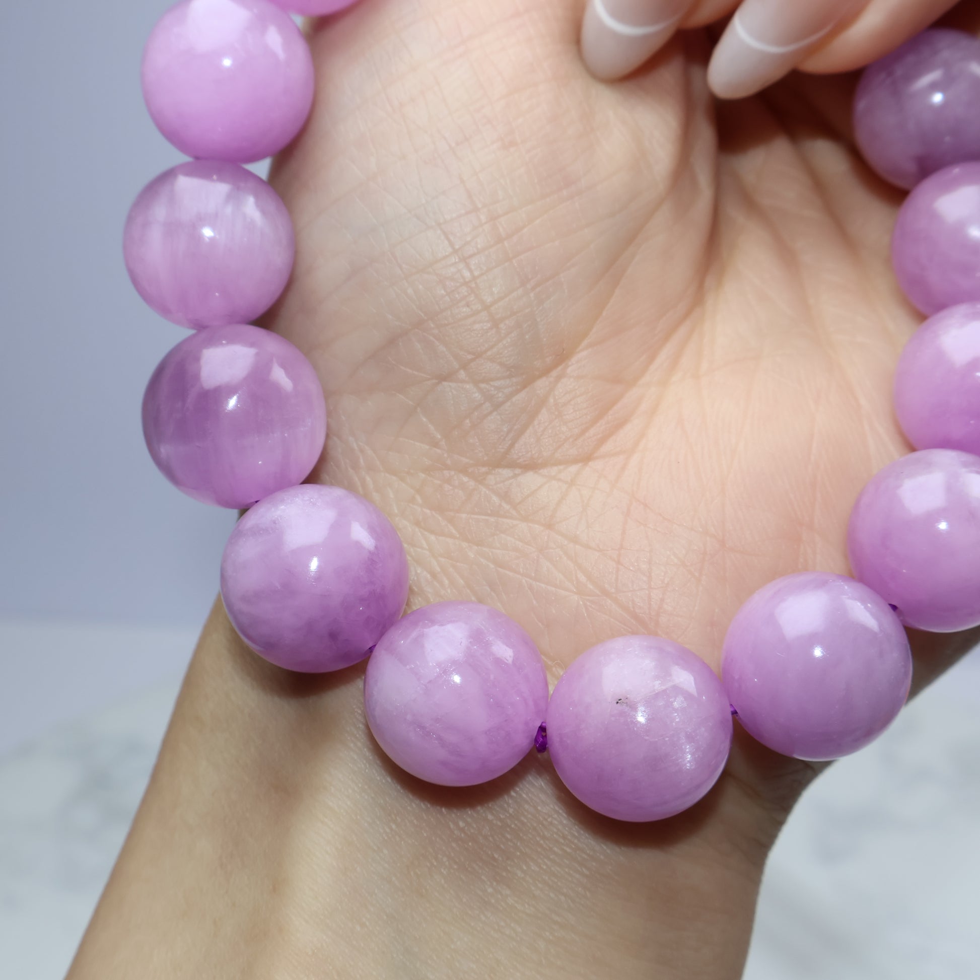 Over-the-top wrist view of bracelet emphasizing bead alignment and dreamy color