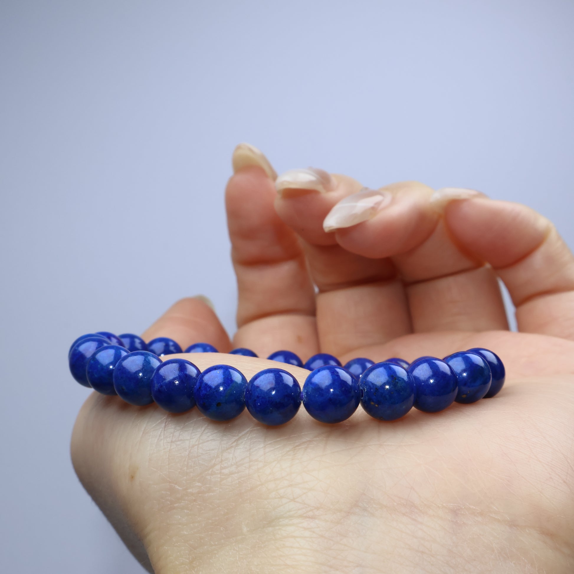 Curved shot across the palm with the bracelet showing minimal inclusions