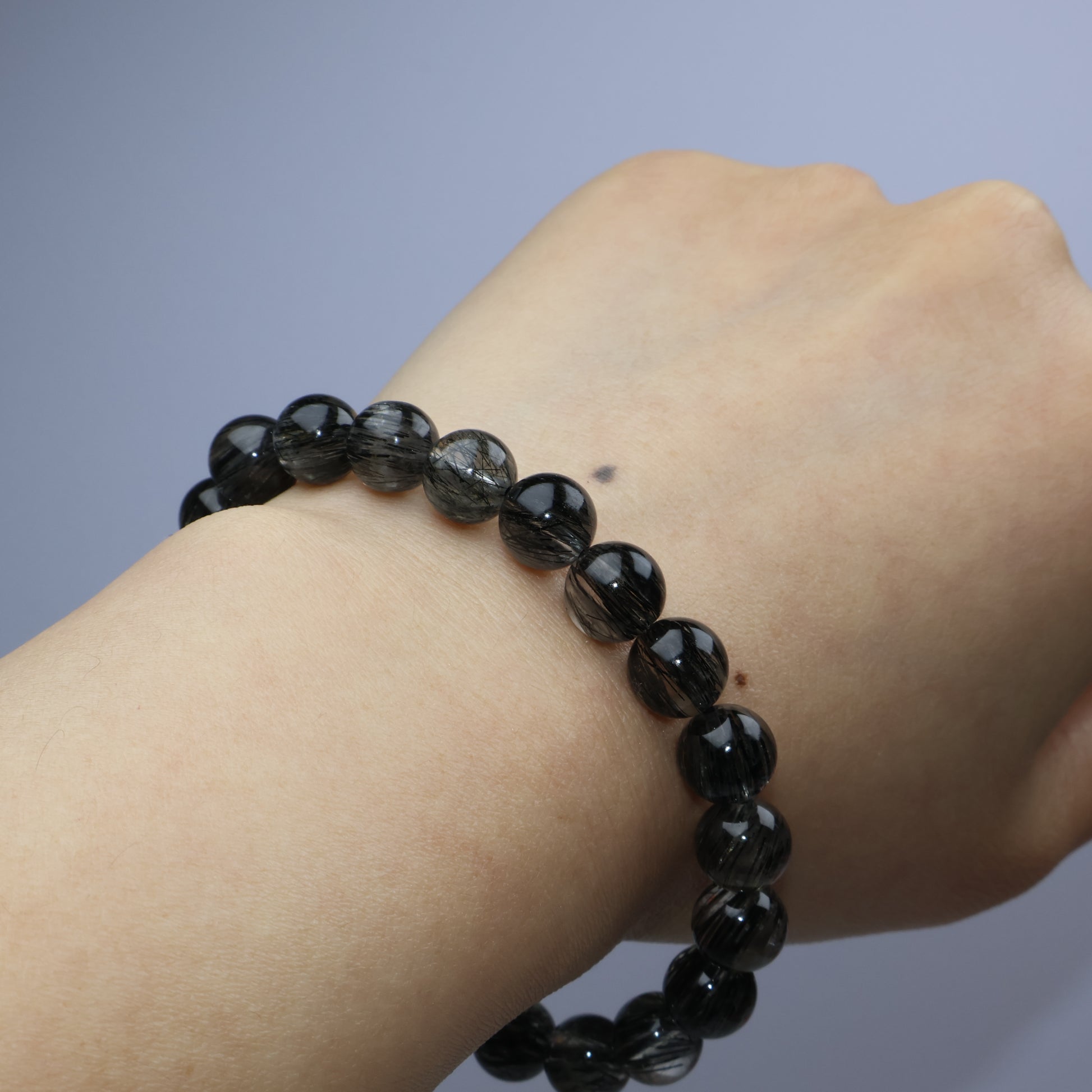 Wrist shot showing how the bracelet fits snugly on a 15.5cm wrist