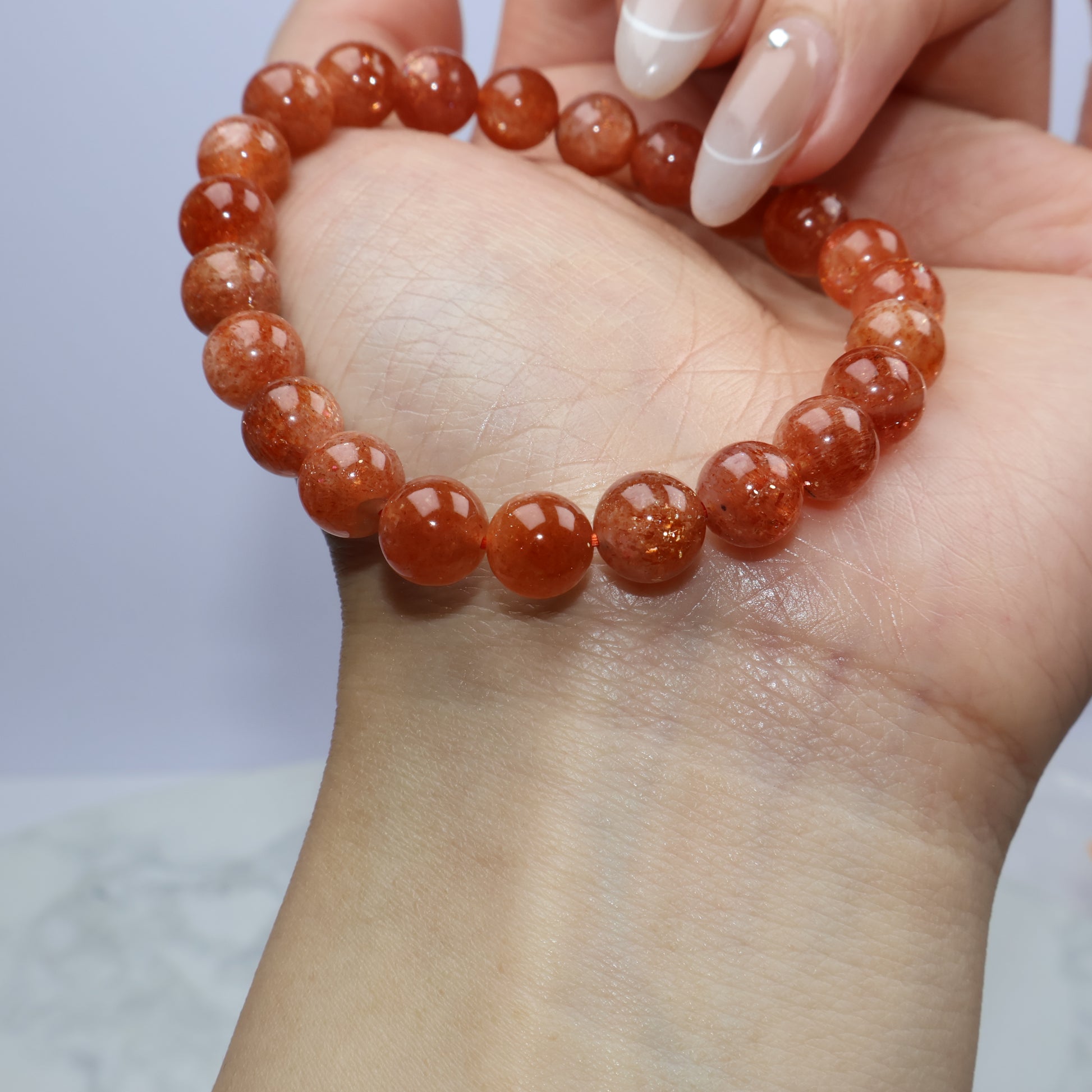 Close-up of Sunstone bracelet showing natural inclusions