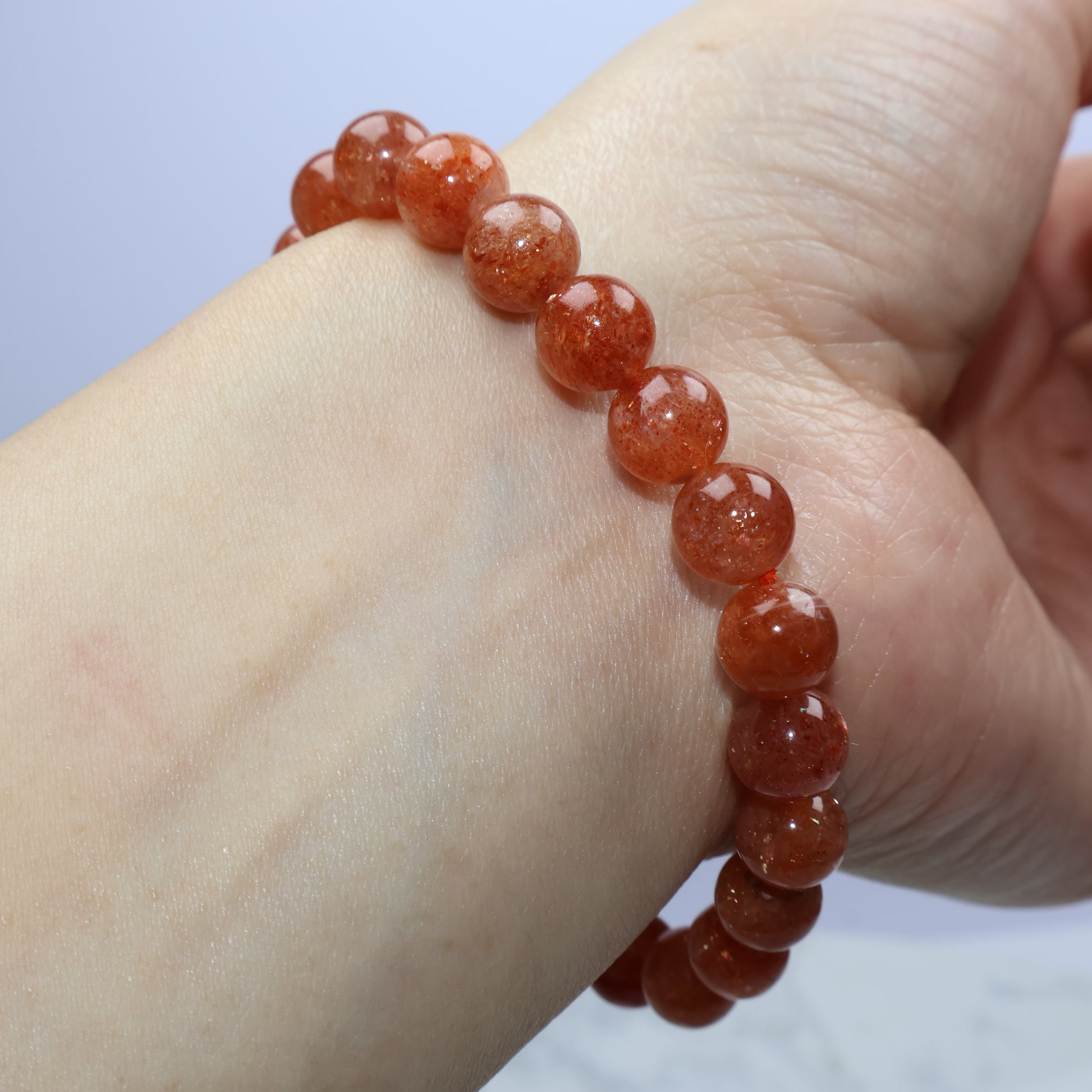 Wrist shot of bracelet capturing warm sunlight-like glow