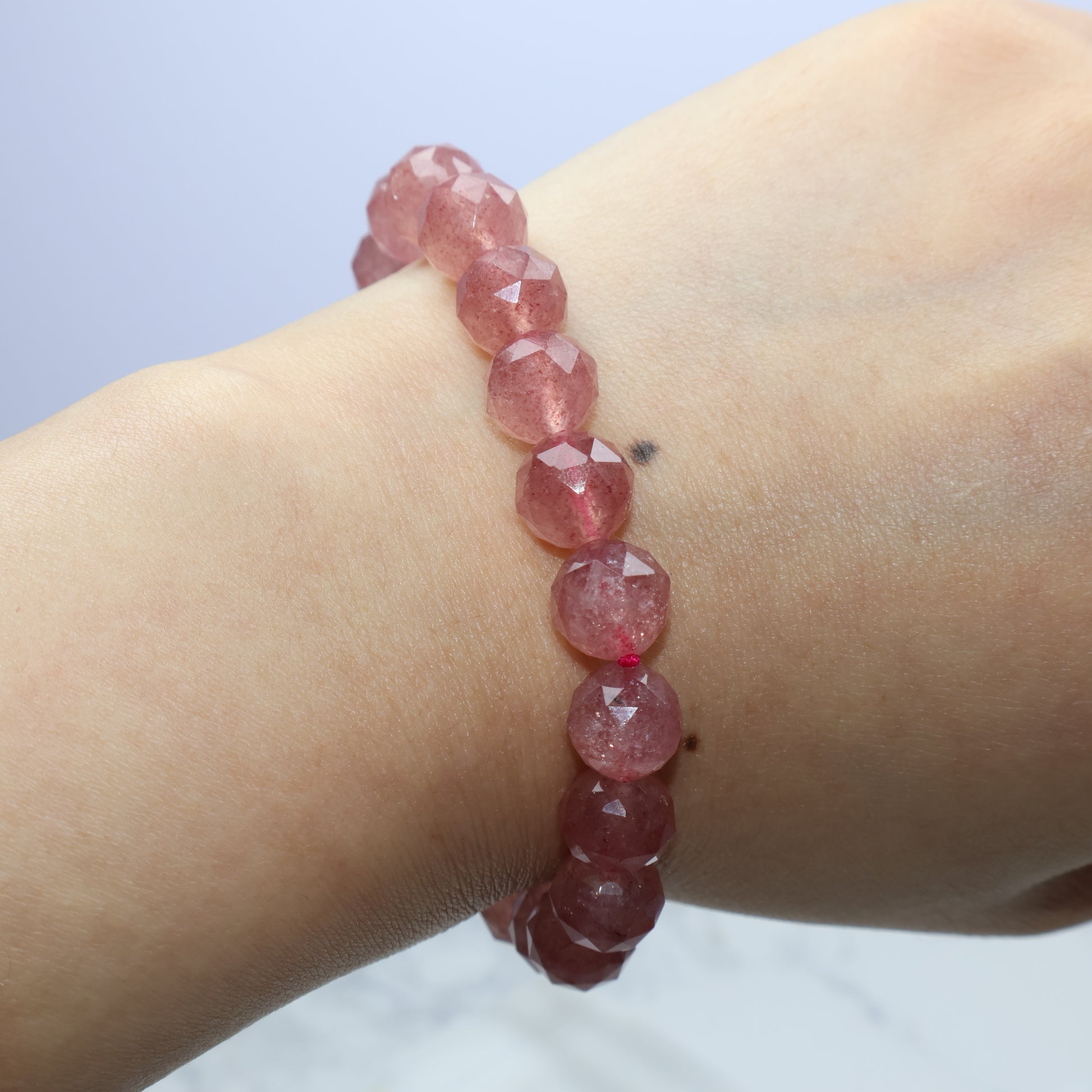 Wrist shot from above showing bracelet curvature and sparkle