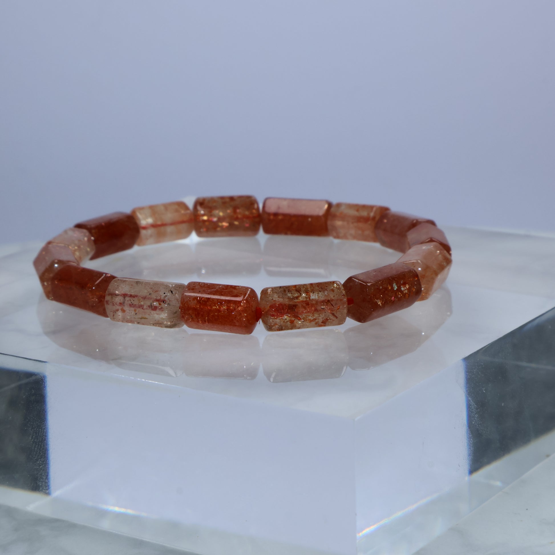 Side angle of Sunstone bracelet showing sparkly barrel beads with natural inclusions