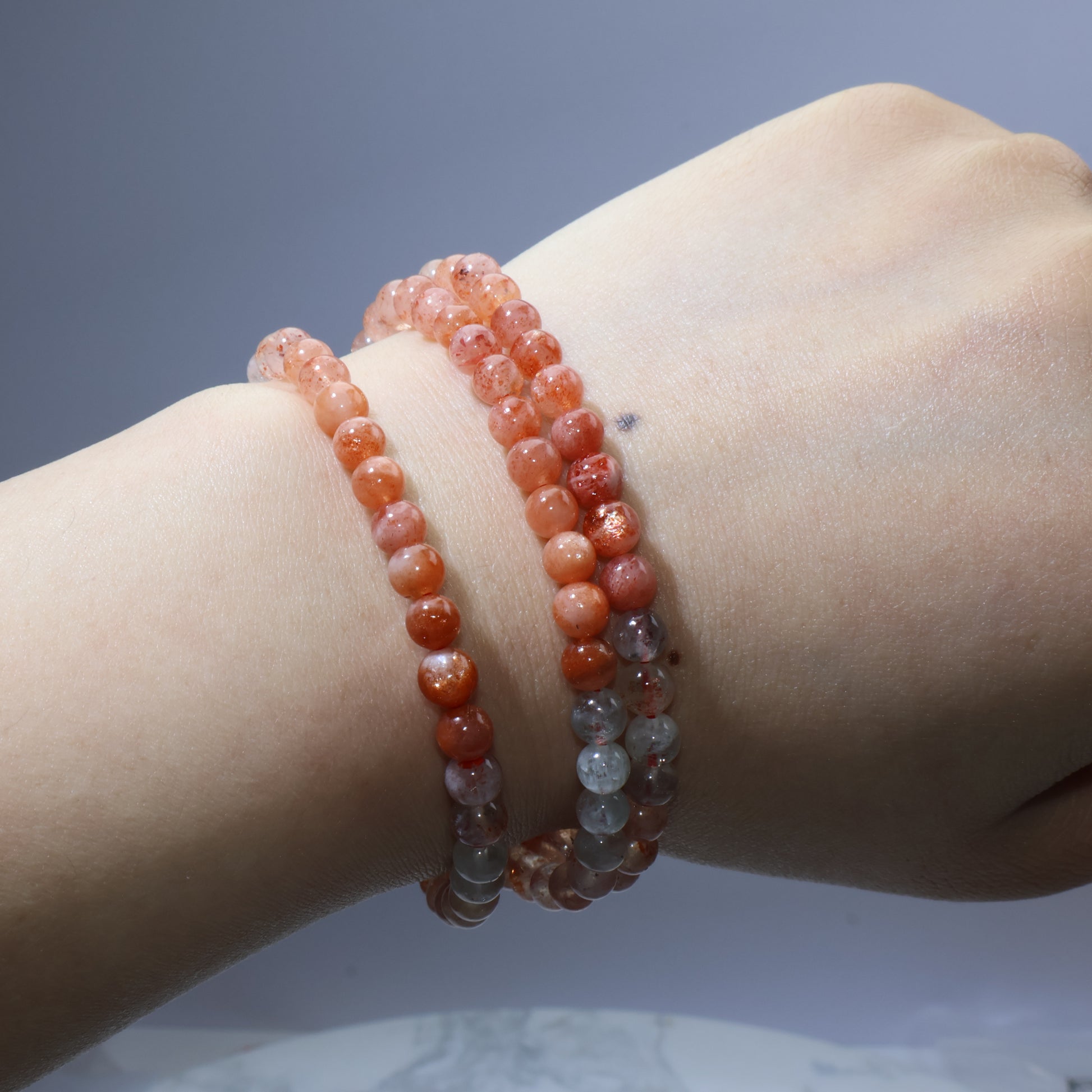 Wrist shot from top showing layered stacking look of the bracelet