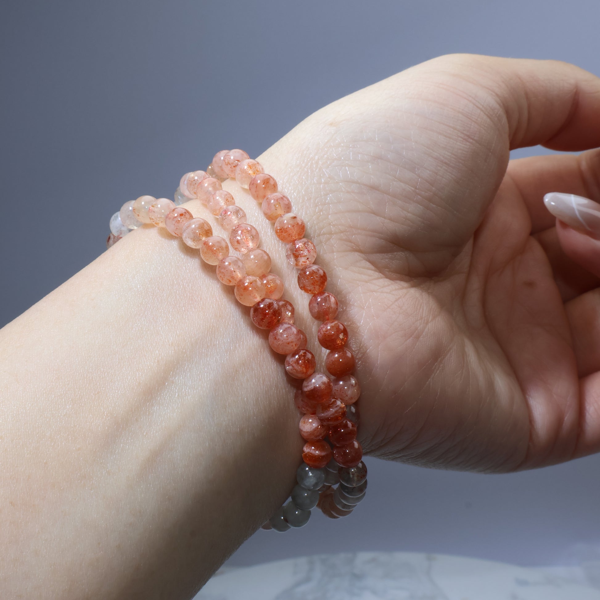 Side wrist angle showing natural luster and dainty size of the beads