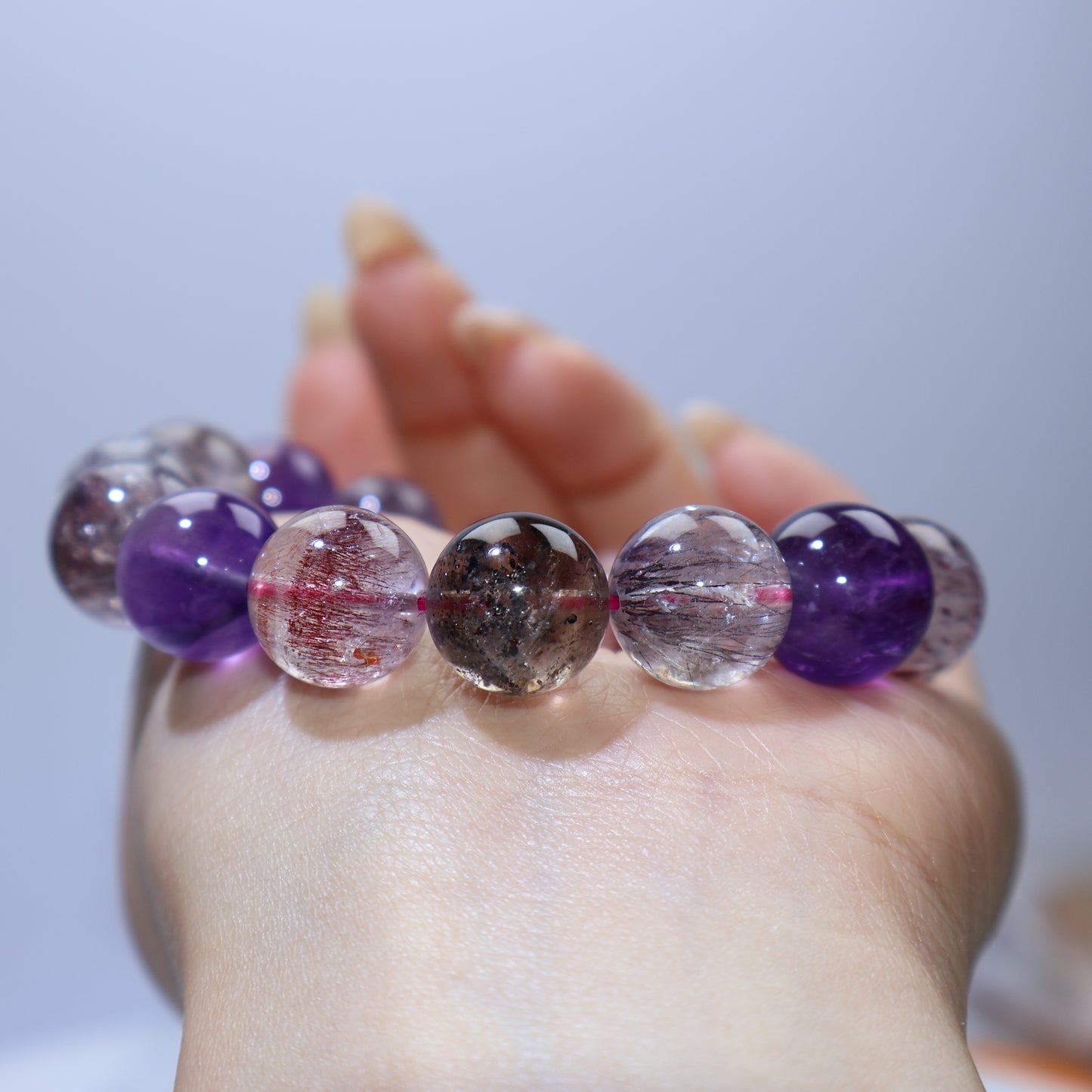 Another palm macro highlighting darker beads with hematite-like specks