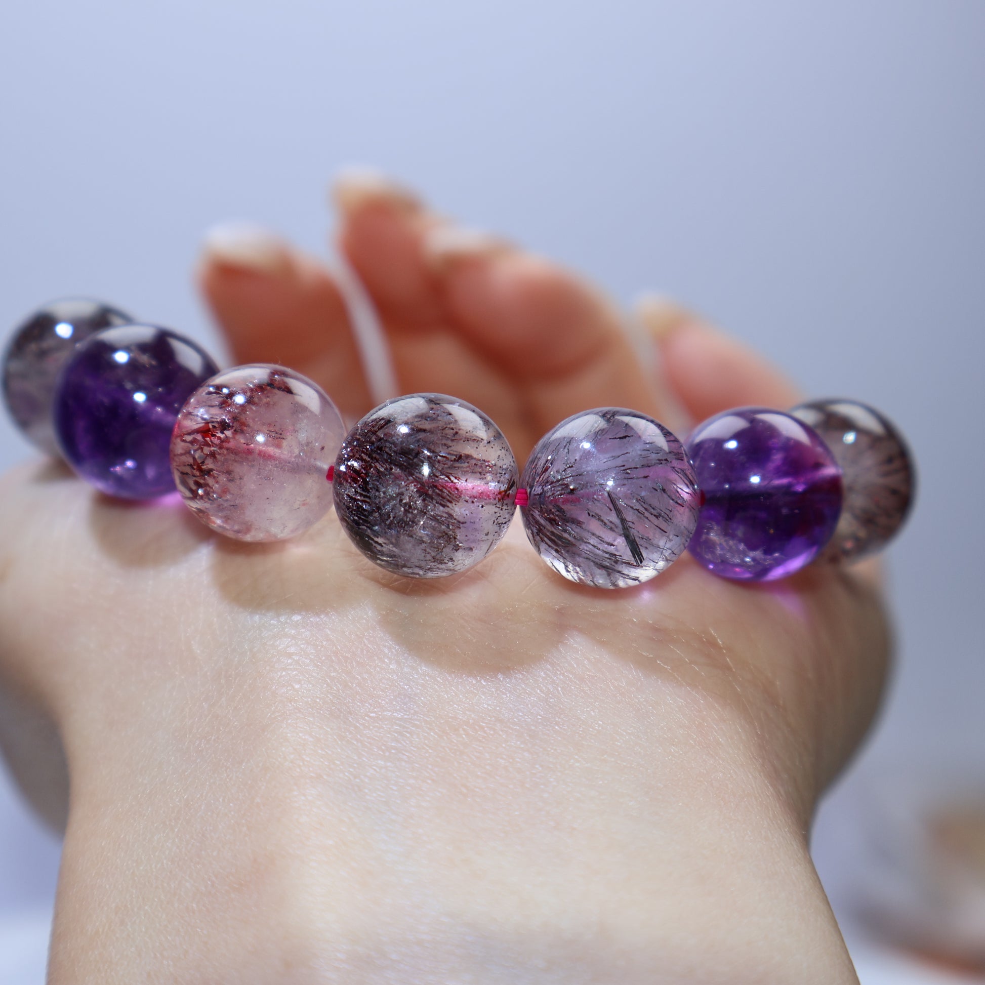 Close row view showing gradient from clear to amethyst and dense needles