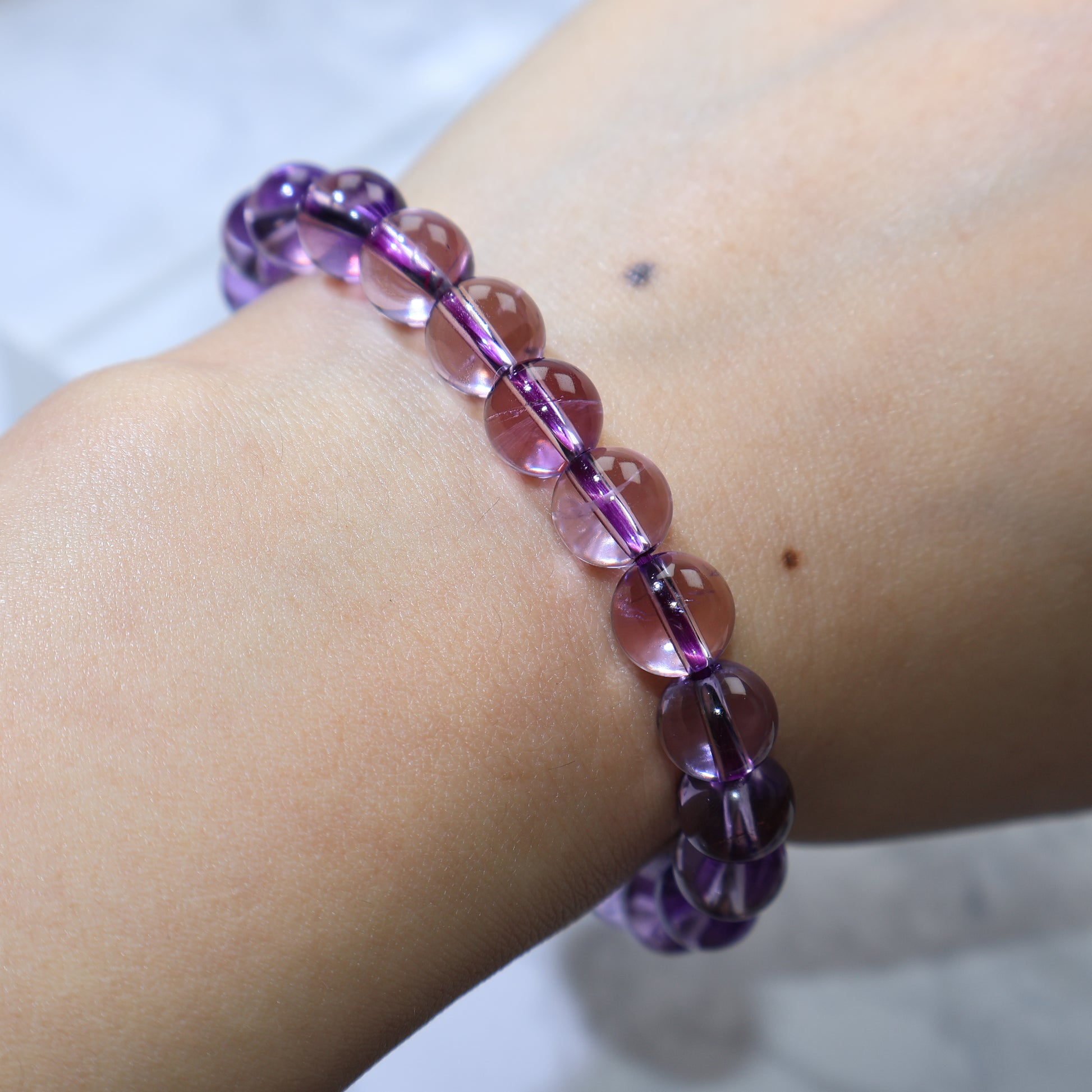 Close-up wrist shot capturing rich color and glass-like luster